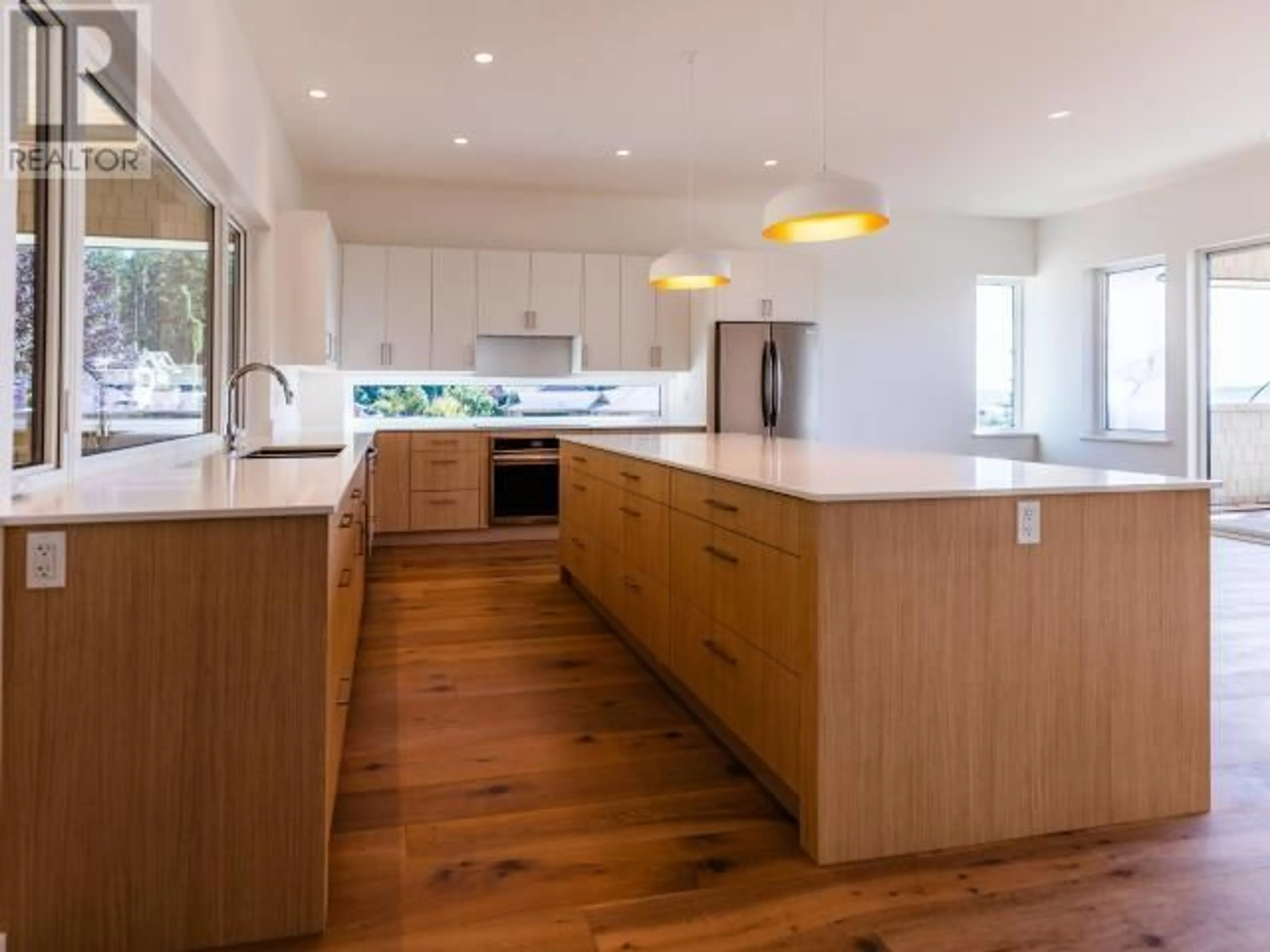 Contemporary kitchen, wood/laminate floor for 3900 EAGLE RIDGE PLACE, Powell River British Columbia V8A0A7