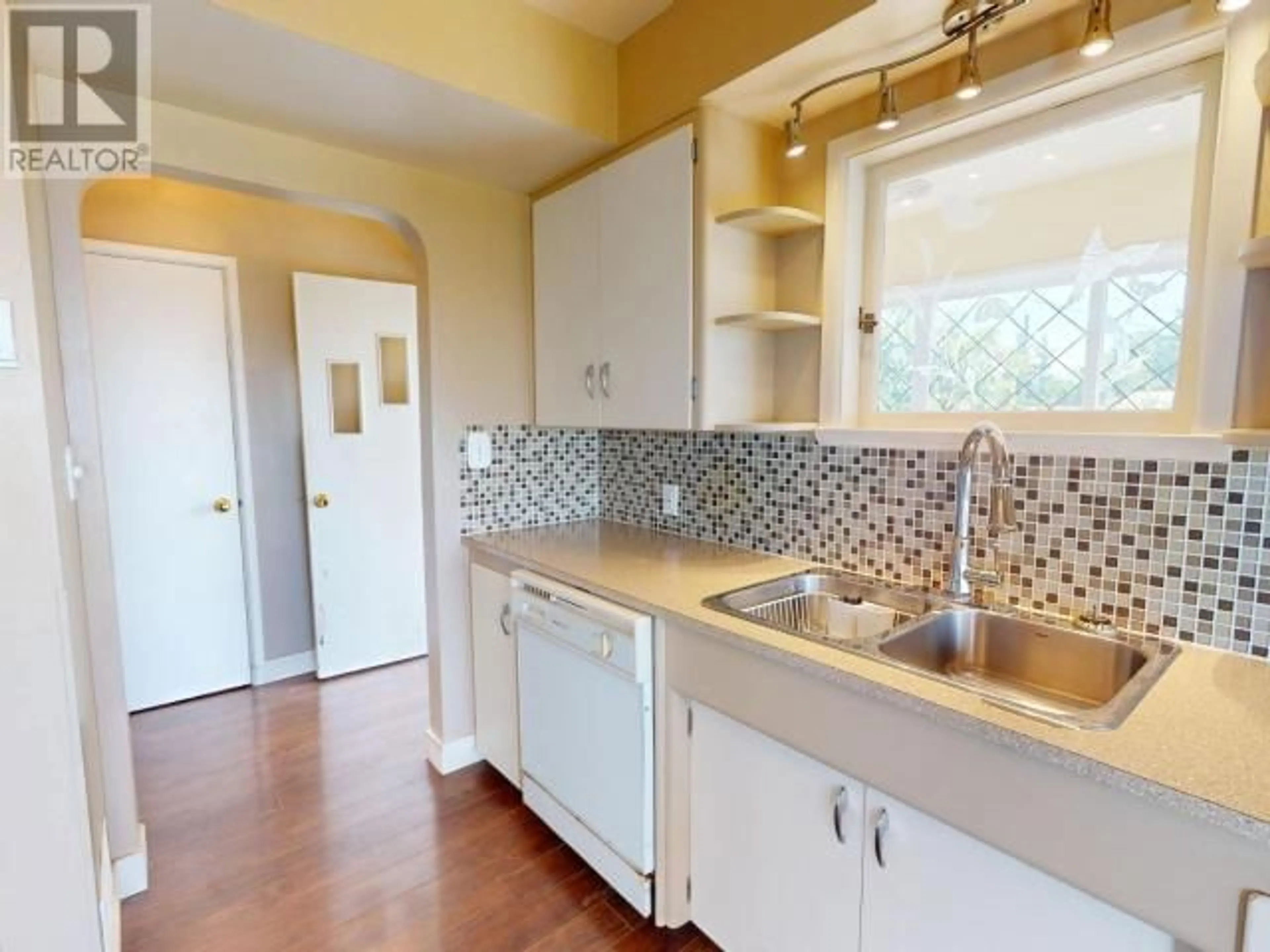 Standard kitchen, ceramic/tile floor for 4467 OMINECA AVE, Powell River British Columbia V8A2P8