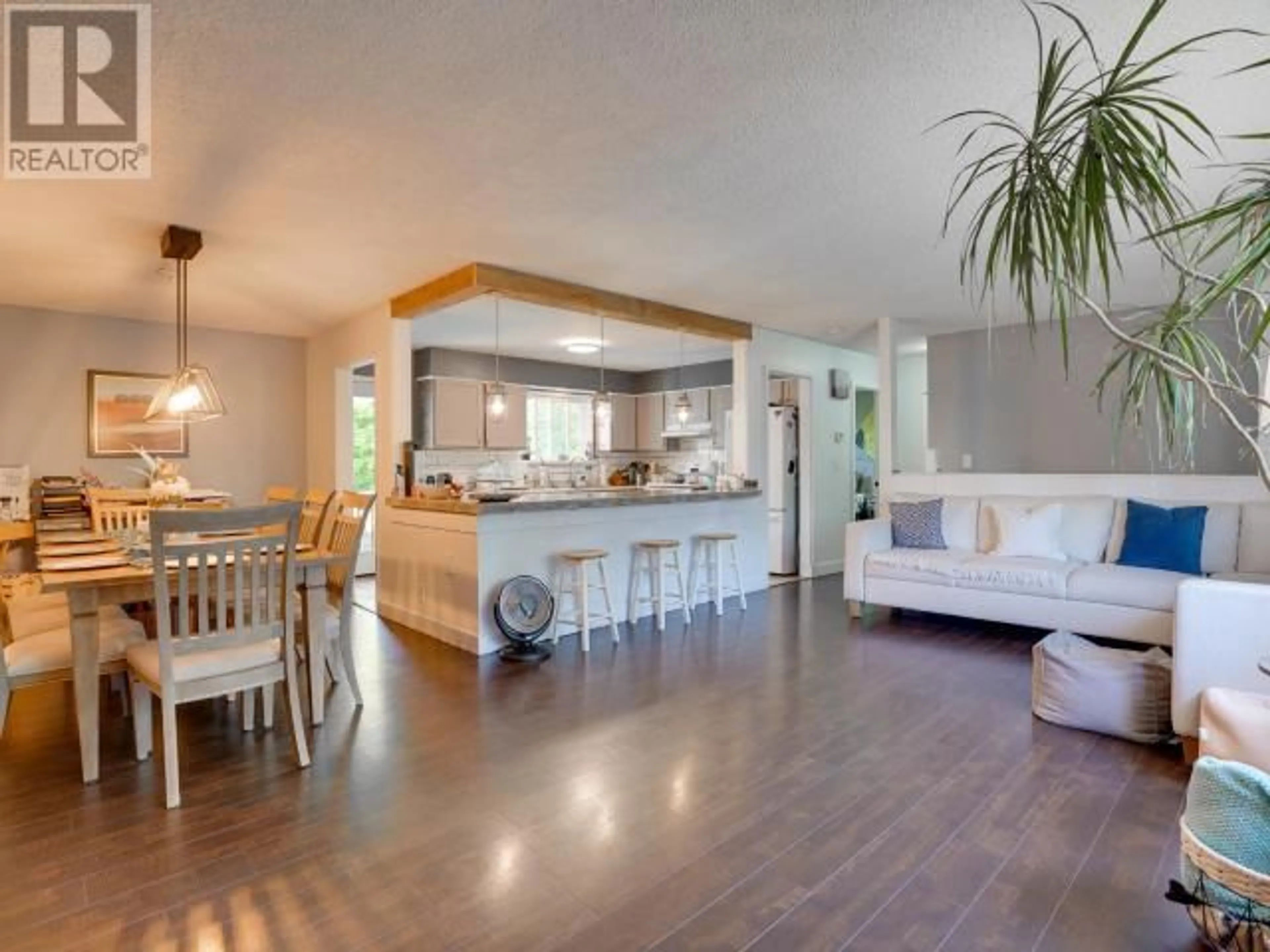 Open concept kitchen, wood/laminate floor for 7215 KEMANO STREET, Powell River British Columbia V8A1M1