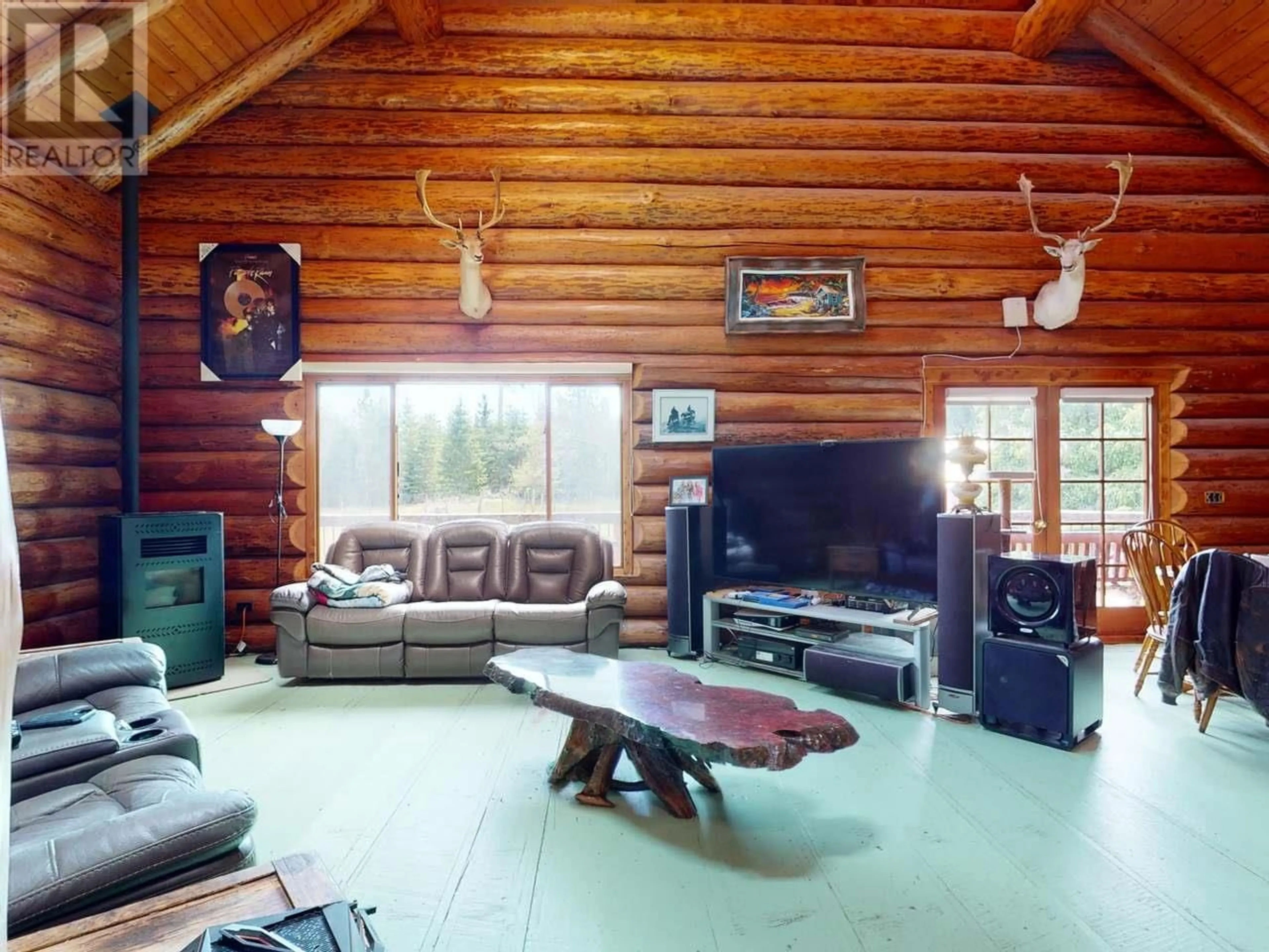 Living room with furniture, wood/laminate floor for 6594 SHELTER POINT ROAD, Texada Island British Columbia V0N1W0