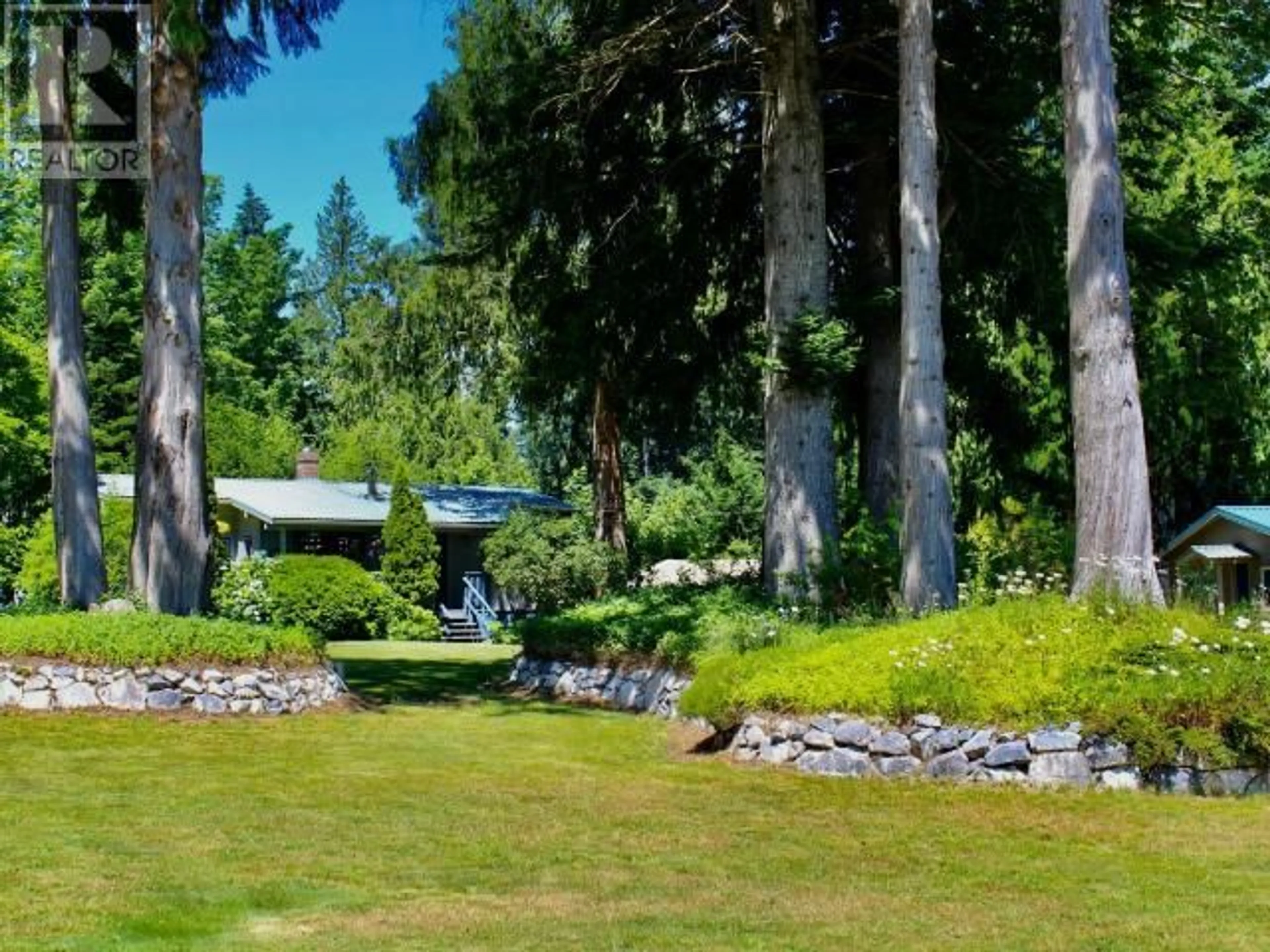 A pic from outside/outdoor area/front of a property/back of a property/a pic from drone, forest/trees view for 10136 DOUGLAS BAY ROAD, Powell River British Columbia V8A0K7