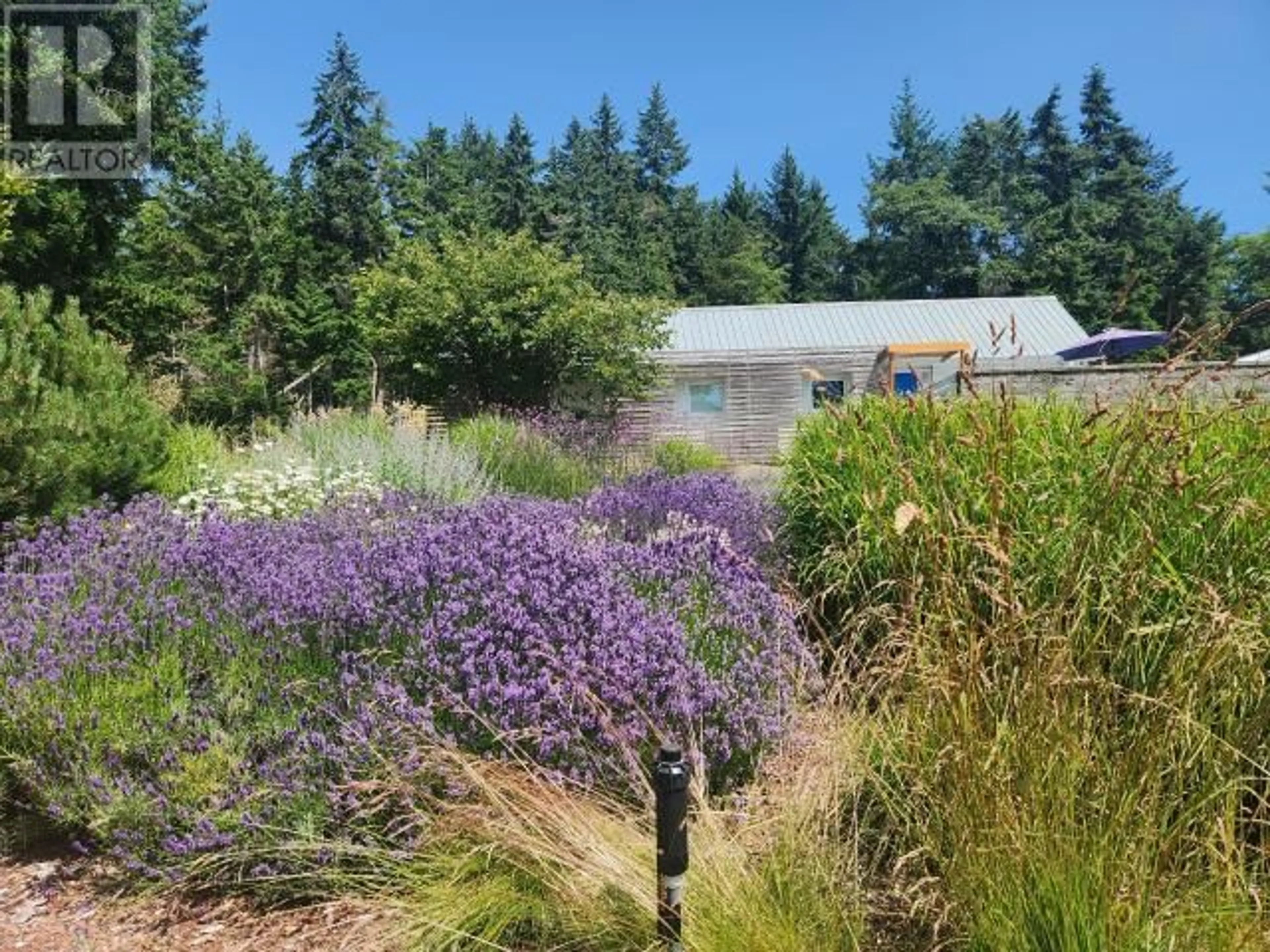 A pic from outside/outdoor area/front of a property/back of a property/a pic from drone, unknown for 5667 GILLIES BAY RD, Texada Island British Columbia