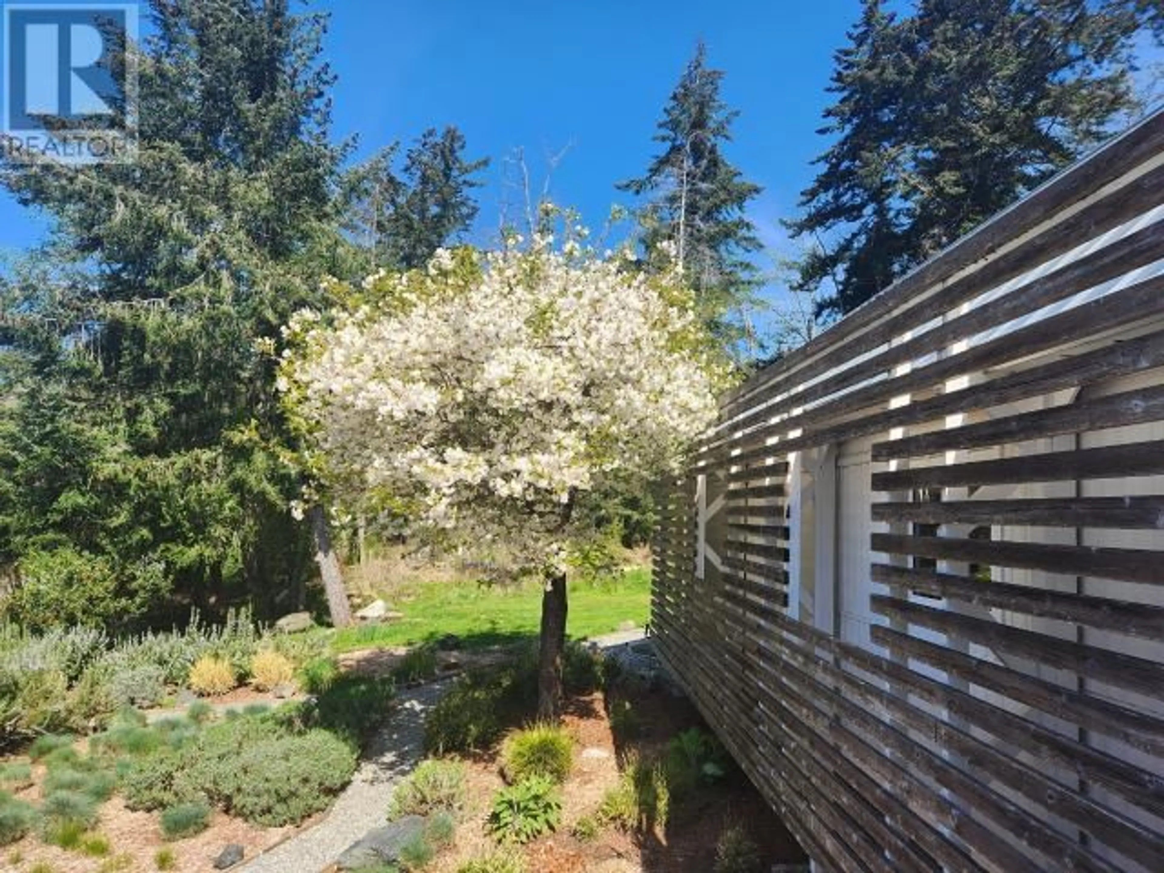 A pic from outside/outdoor area/front of a property/back of a property/a pic from drone, forest/trees view for 5667 GILLIES BAY RD, Texada Island British Columbia