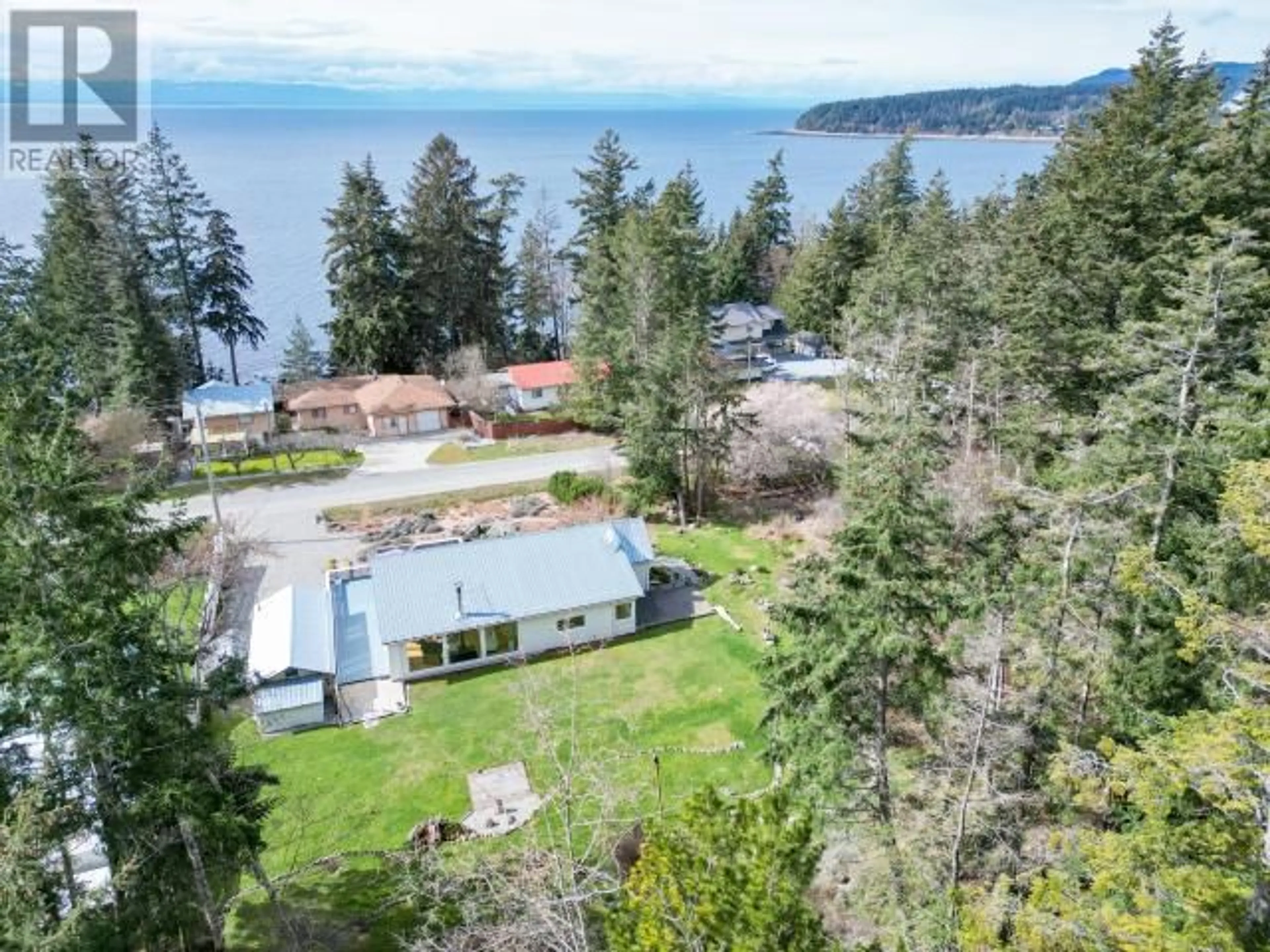 A pic from outside/outdoor area/front of a property/back of a property/a pic from drone, water/lake/river/ocean view for 5667 GILLIES BAY RD, Texada Island British Columbia