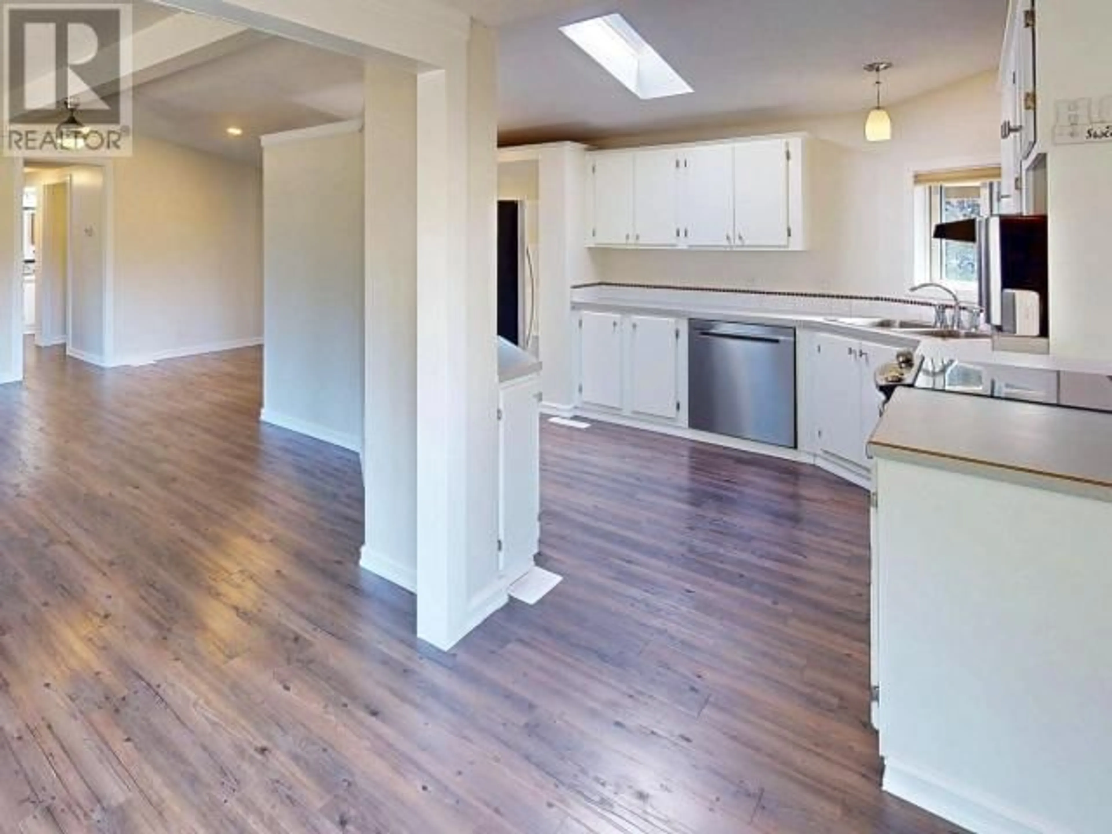 Open concept kitchen, wood/laminate floor for 7310 GODDARD STREET, Powell River British Columbia V8A5N7
