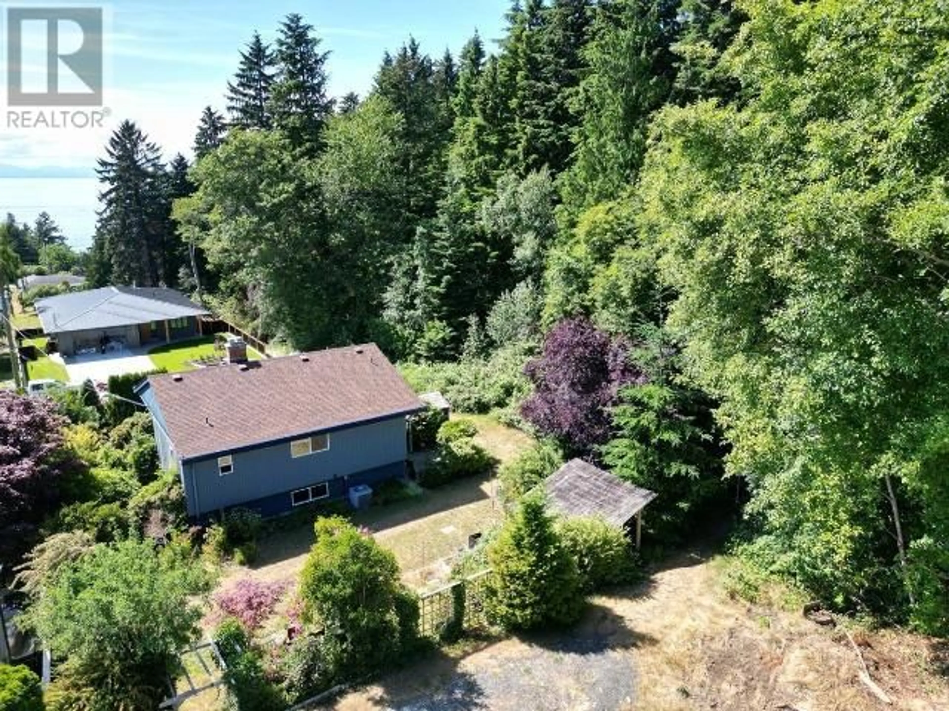 A pic from outside/outdoor area/front of a property/back of a property/a pic from drone, forest/trees view for 3638 STRATHCONA AVE, Powell River British Columbia V8A2V4