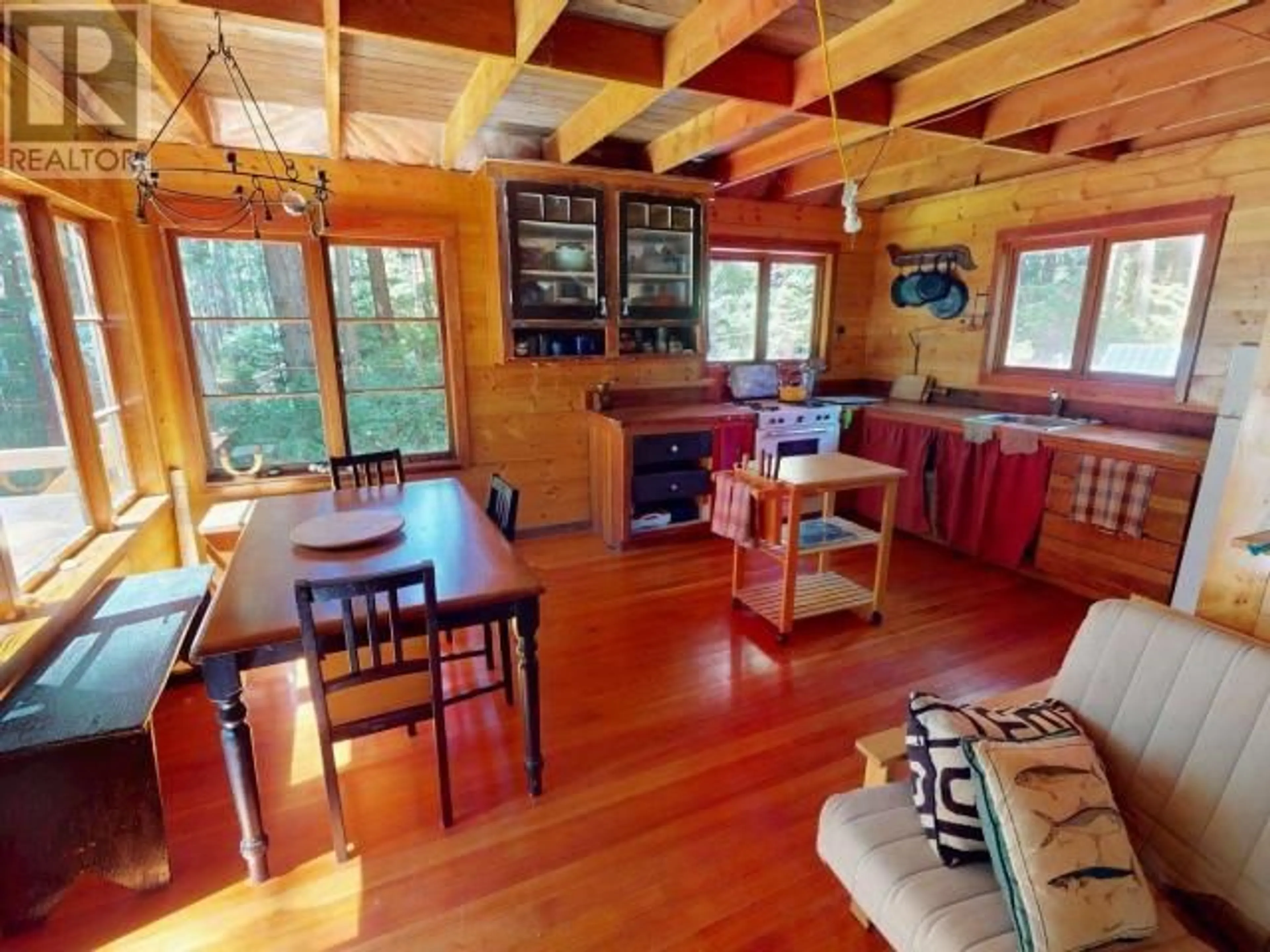 Living room with furniture, wood/laminate floor for 1297 TENNYSON RD, Savary Island British Columbia