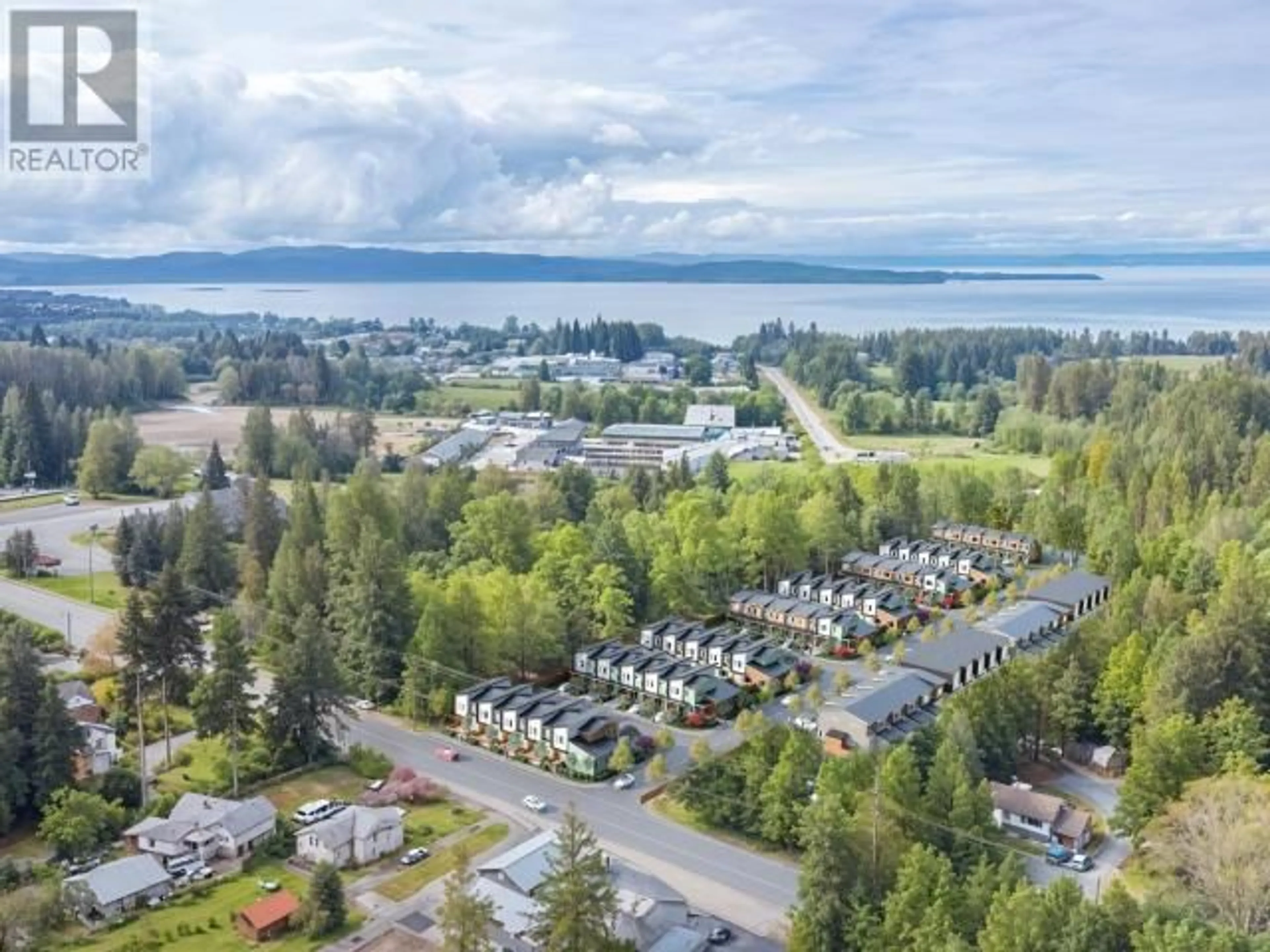 A pic from outside/outdoor area/front of a property/back of a property/a pic from drone, water/lake/river/ocean view for 205 - 5191 MANSON AVE, Powell River British Columbia V8A3P2