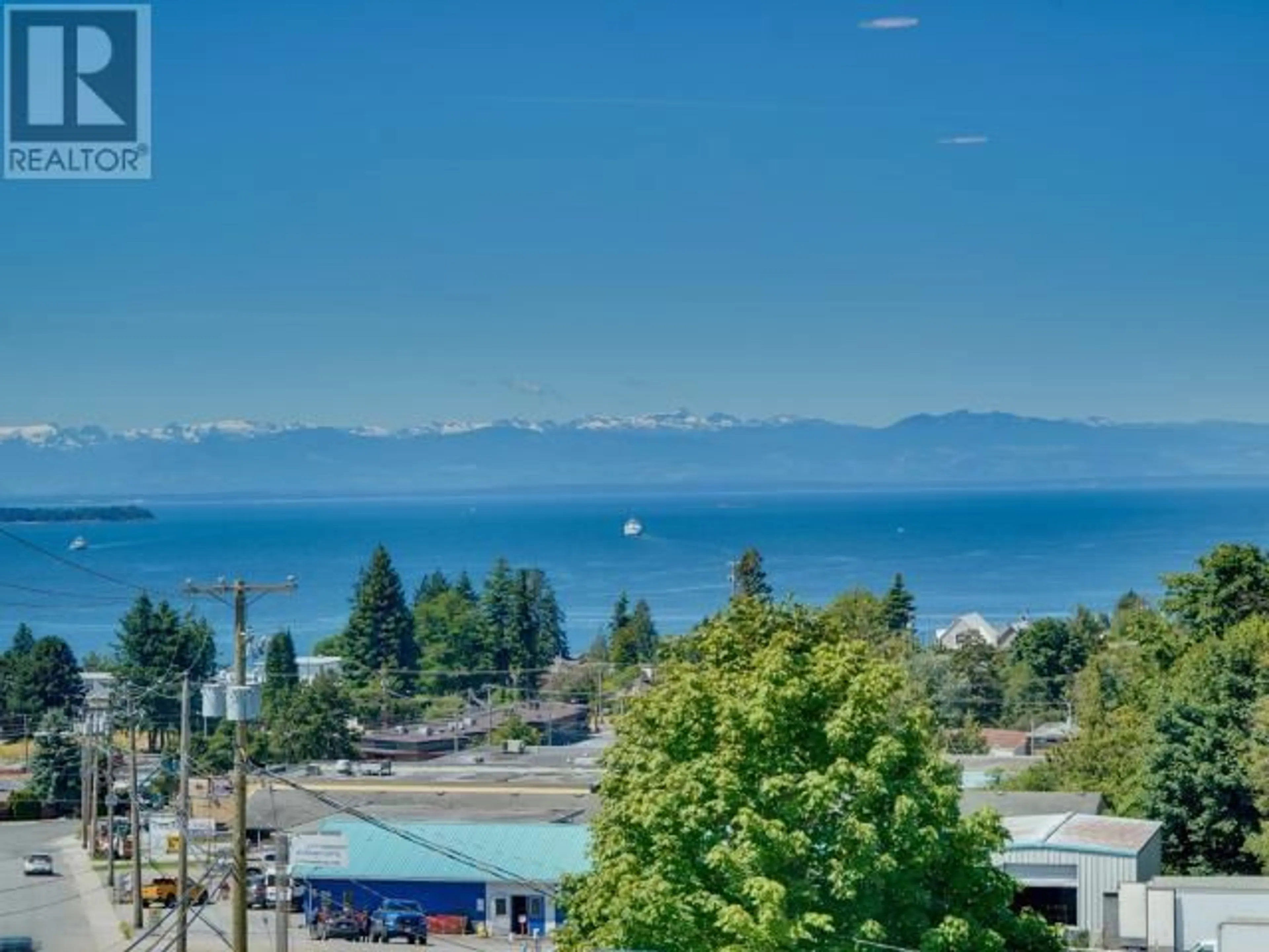 A pic from outside/outdoor area/front of a property/back of a property/a pic from drone, water/lake/river/ocean view for 401 - 7175 DUNCAN STREET, Powell River British Columbia V8A1W3