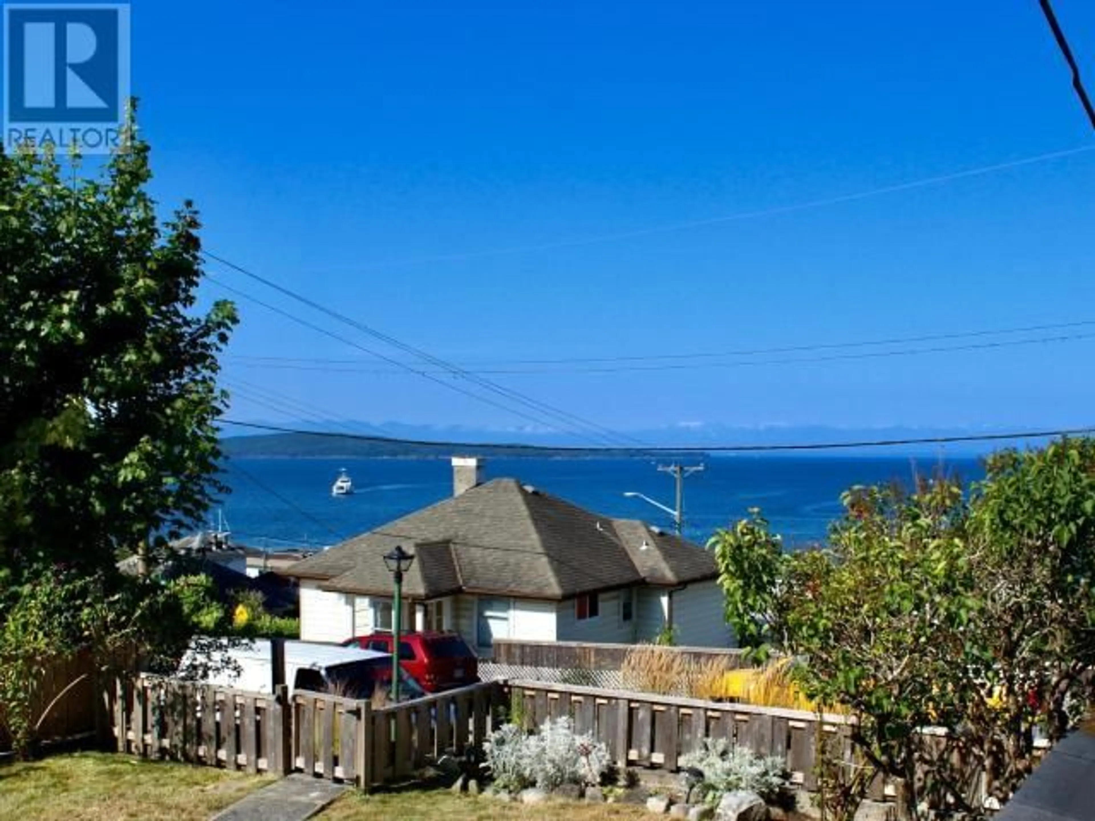 A pic from outside/outdoor area/front of a property/back of a property/a pic from drone, water/lake/river/ocean view for 4444 OMINECA AVE, Powell River British Columbia V8A2P7
