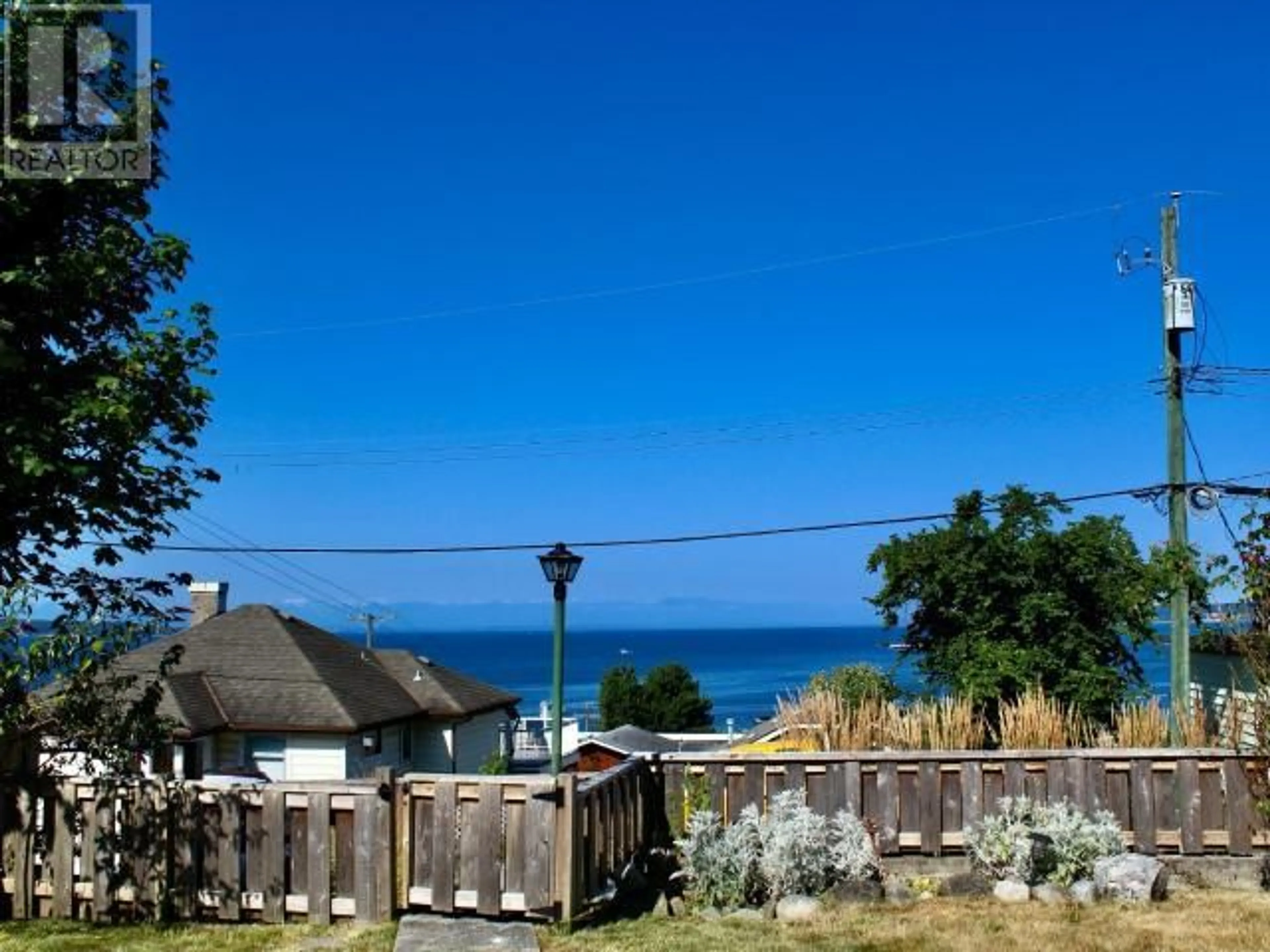 A pic from outside/outdoor area/front of a property/back of a property/a pic from drone, water/lake/river/ocean view for 4444 OMINECA AVE, Powell River British Columbia V8A2P7