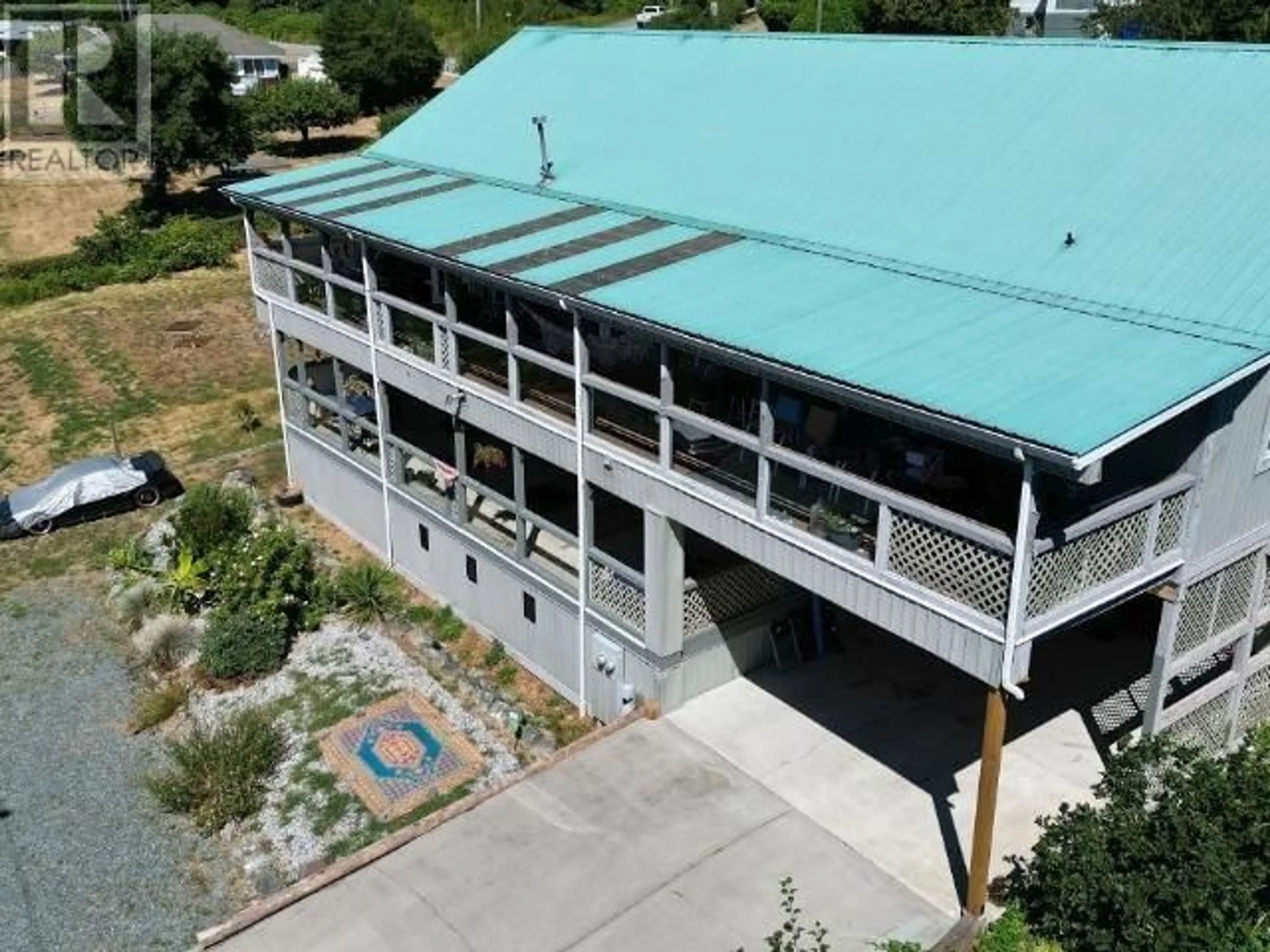 A pic from outside/outdoor area/front of a property/back of a property/a pic from drone, building for 8075 CENTENNIAL DRIVE, Powell River British Columbia V8A0S4