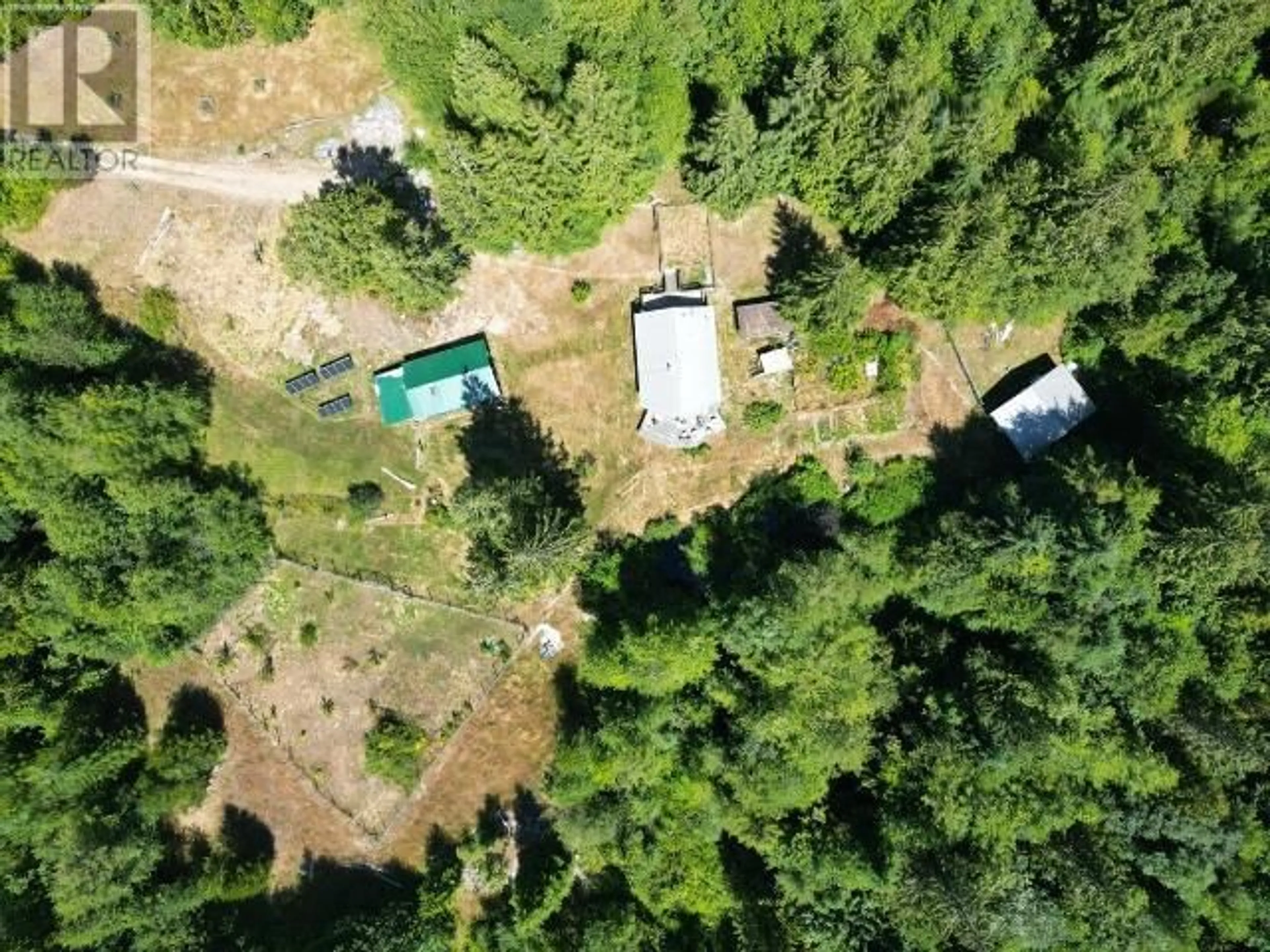 A pic from outside/outdoor area/front of a property/back of a property/a pic from drone, forest/trees view for 6000 DEIGHTON CREEK ROAD, Powell River British Columbia V8A0G8