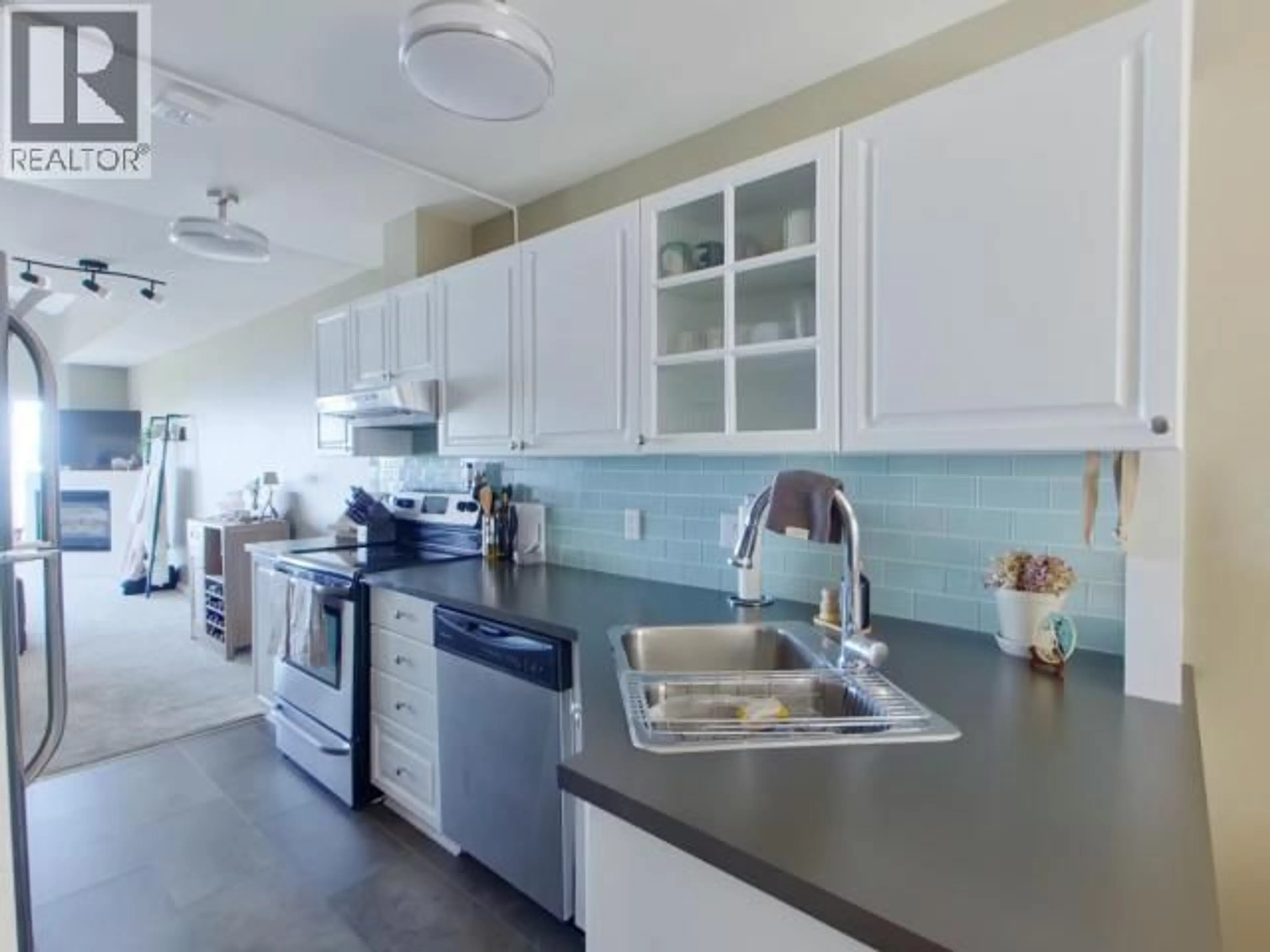 Open concept kitchen, ceramic/tile floor for 302 - 4510 WILLINGDON AVE, Powell River British Columbia V8A2M8