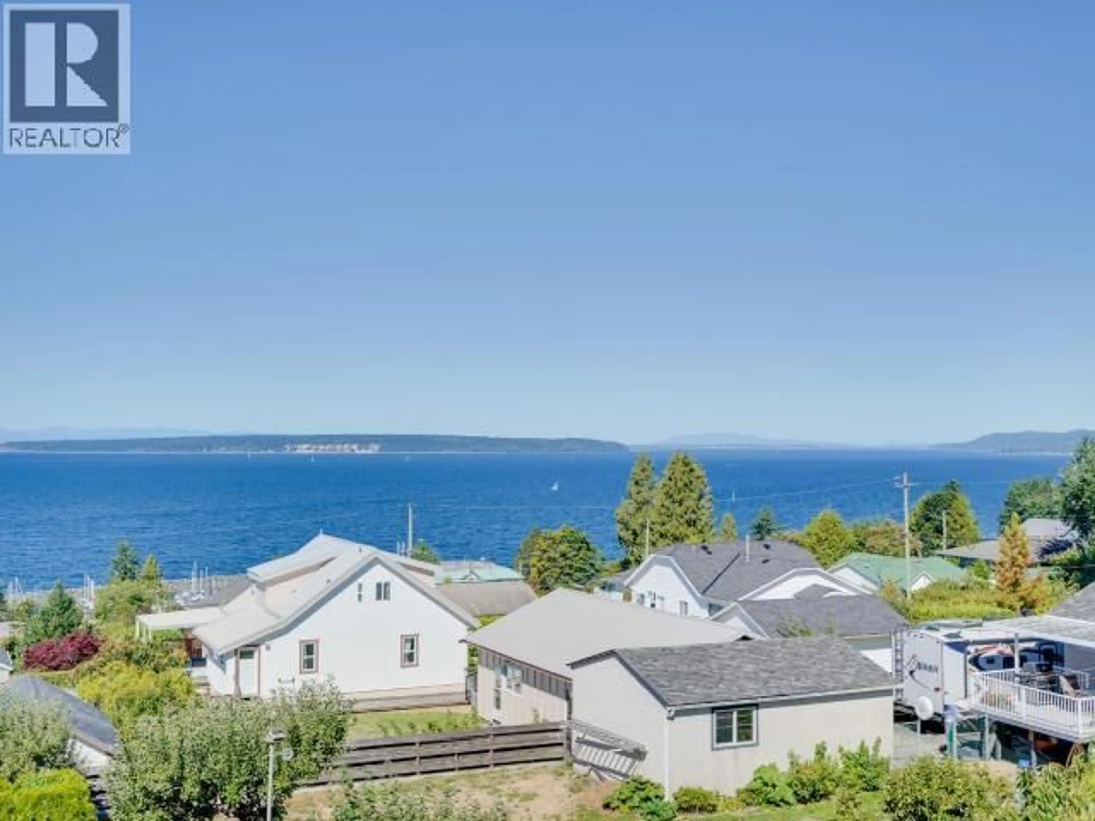 A pic from outside/outdoor area/front of a property/back of a property/a pic from drone, water/lake/river/ocean view for 303 - 4477 MICHIGAN AVE, Powell River British Columbia