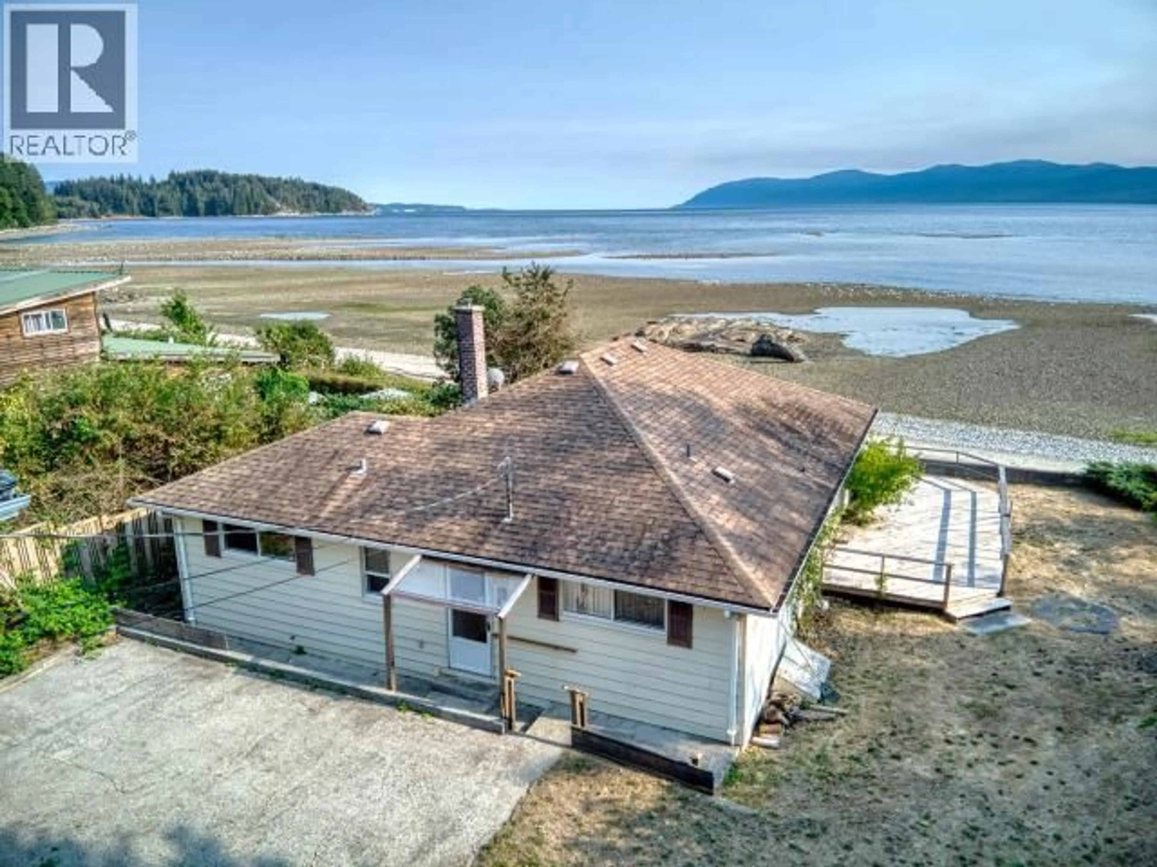 A pic from outside/outdoor area/front of a property/back of a property/a pic from drone, water/lake/river/ocean view for 11373 STUSTUS ROAD, Powell River British Columbia V8A0M2