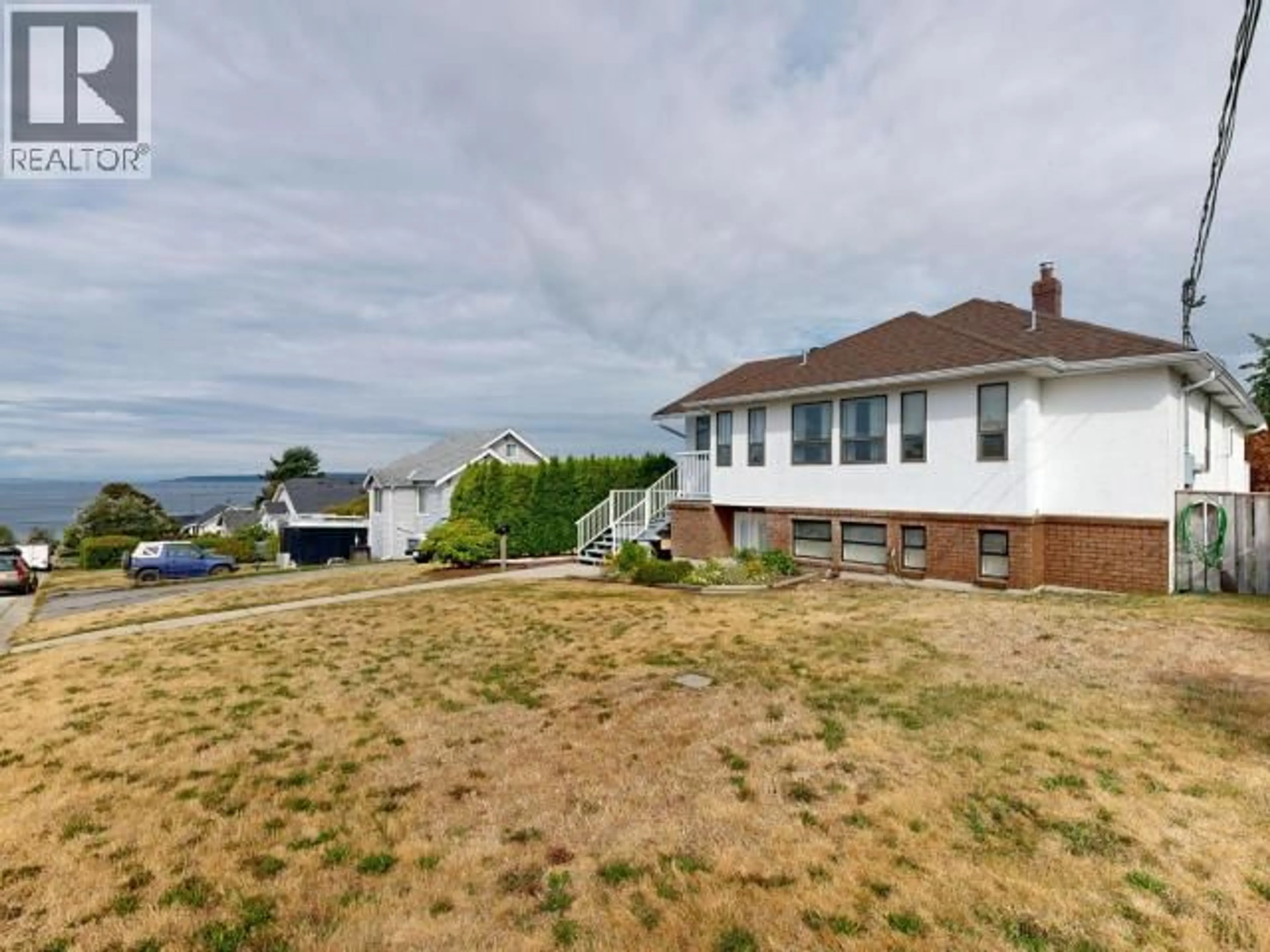 A pic from outside/outdoor area/front of a property/back of a property/a pic from drone, water/lake/river/ocean view for 6921 JASPER STREET, Powell River British Columbia V8A1N4
