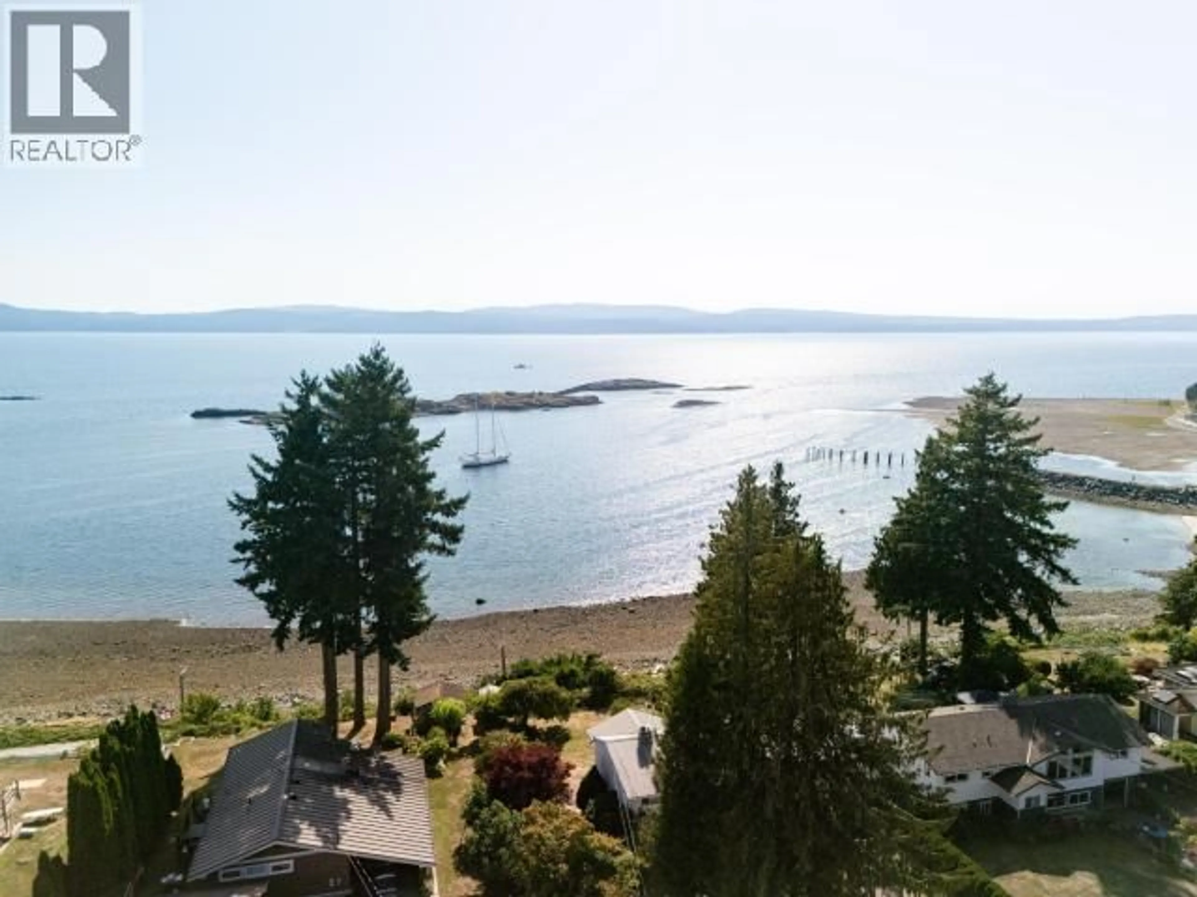 A pic from outside/outdoor area/front of a property/back of a property/a pic from drone, water/lake/river/ocean view for 8230 CENTENNIAL DRIVE, Powell River British Columbia