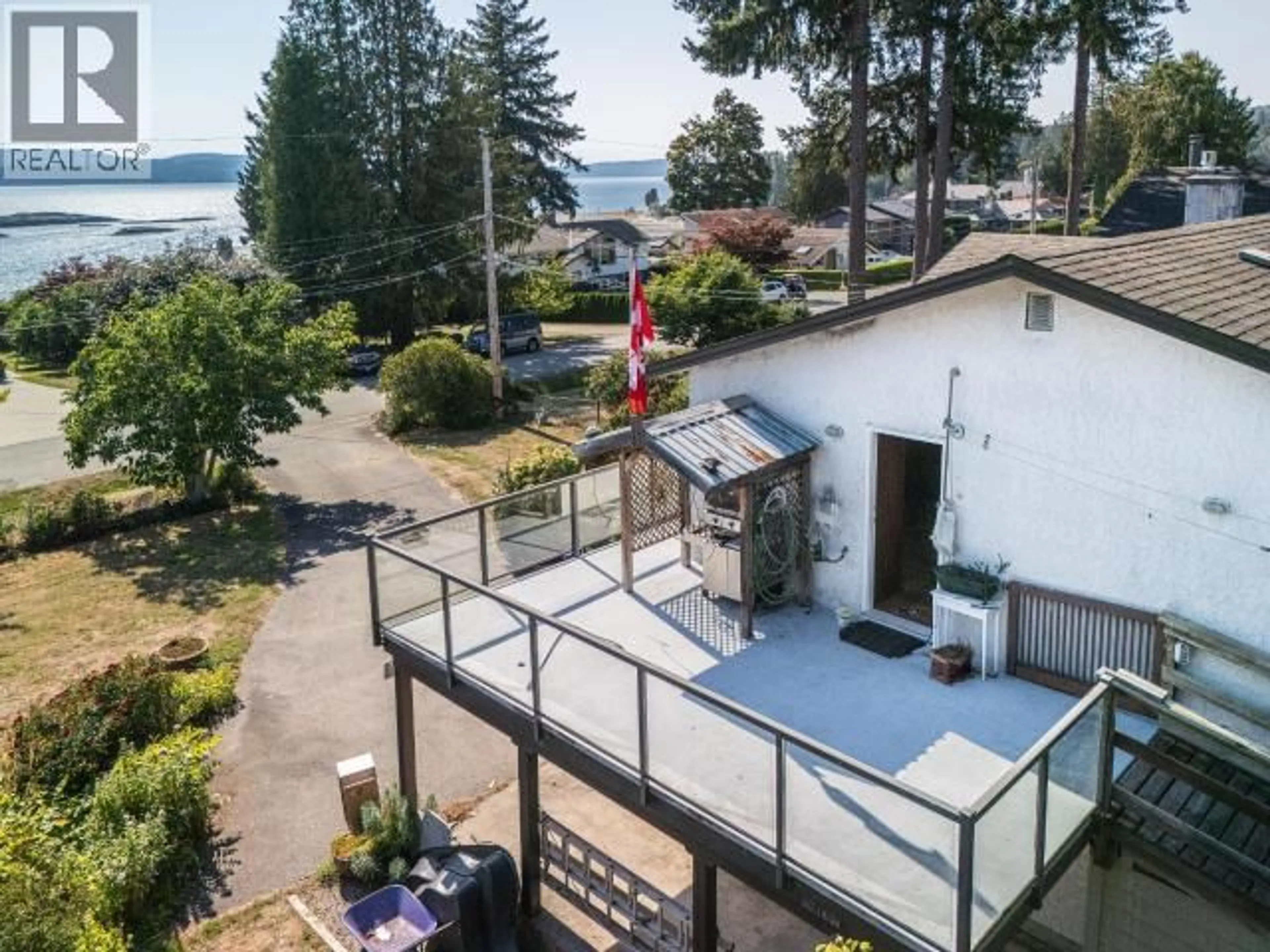 A pic from outside/outdoor area/front of a property/back of a property/a pic from drone, water/lake/river/ocean view for 8230 CENTENNIAL DRIVE, Powell River British Columbia