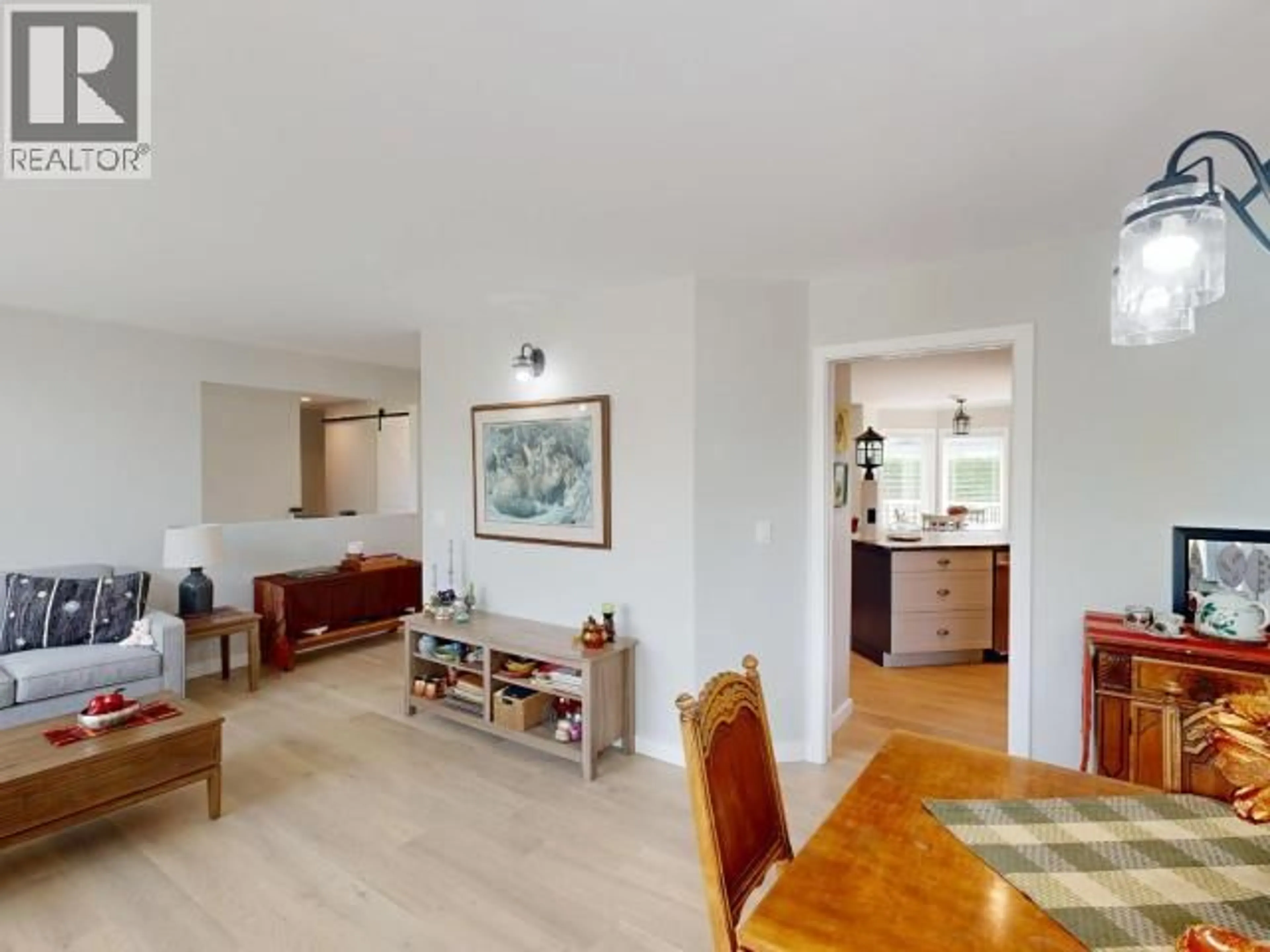 Living room with furniture, wood/laminate floor for 4010 SATURNA AVE, Powell River British Columbia V8A5T4