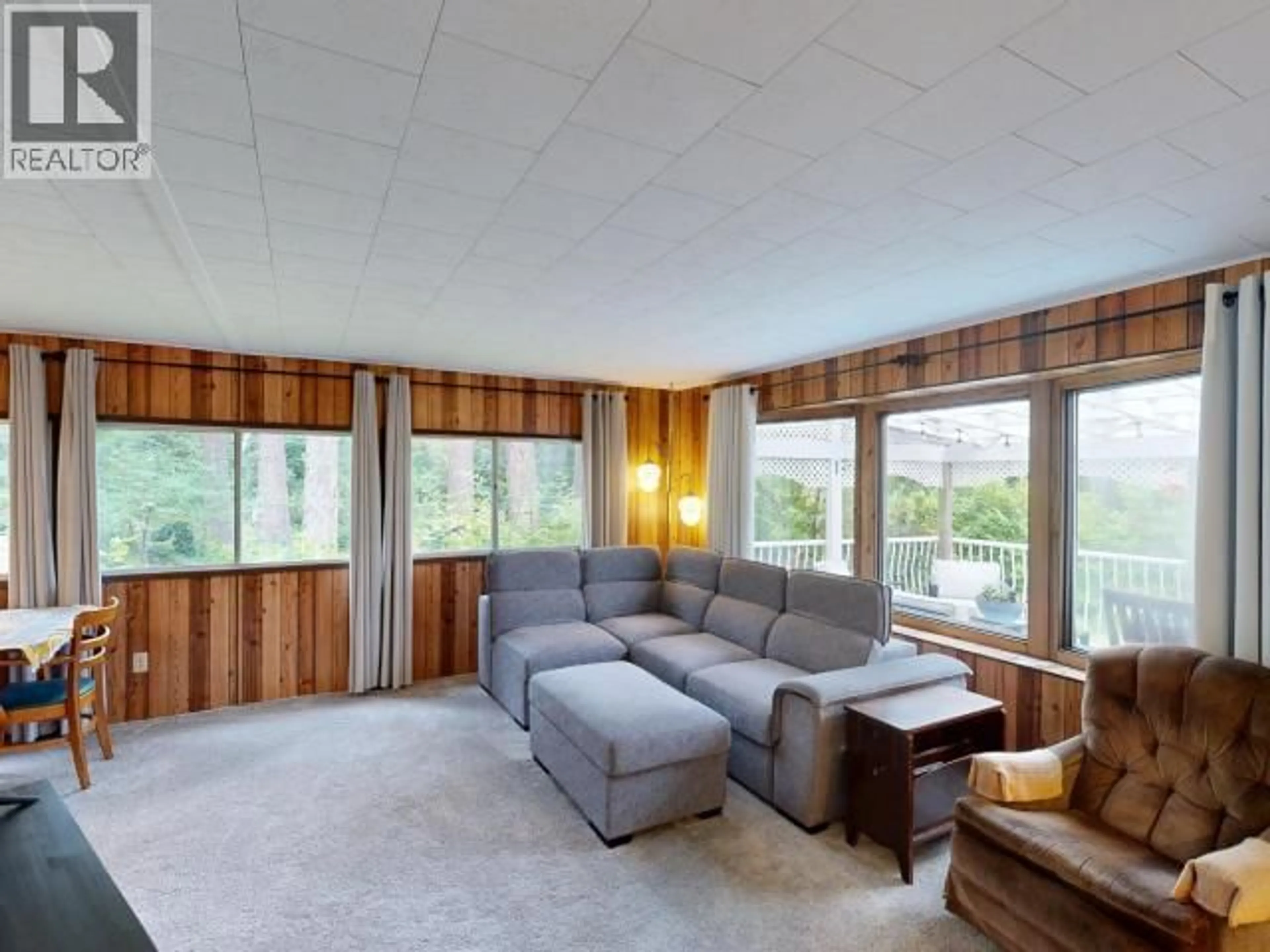 Living room with furniture, wood/laminate floor for 2207 DONKERSLEY ROAD, Powell River British Columbia V8A0K6