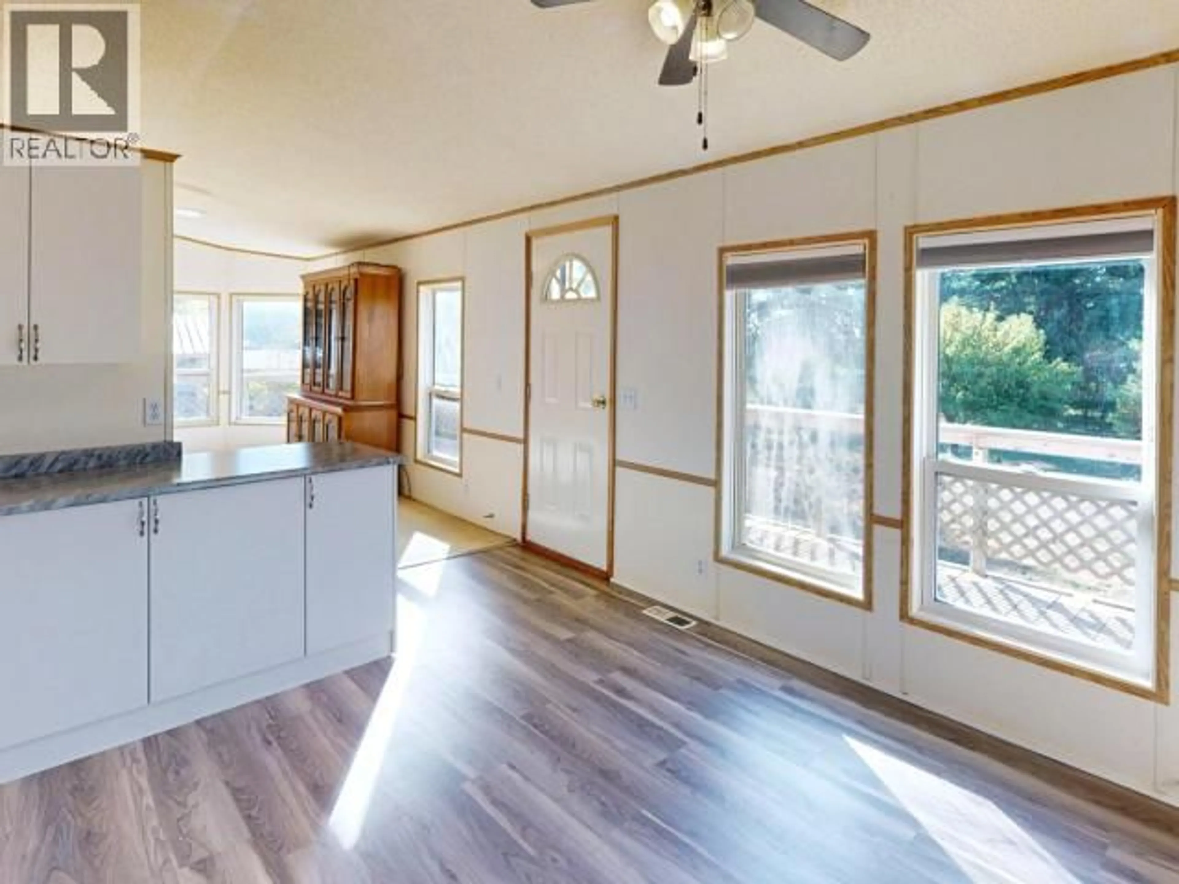 Open concept kitchen, wood/laminate floor for 3043 OAK STREET, Texada Island British Columbia