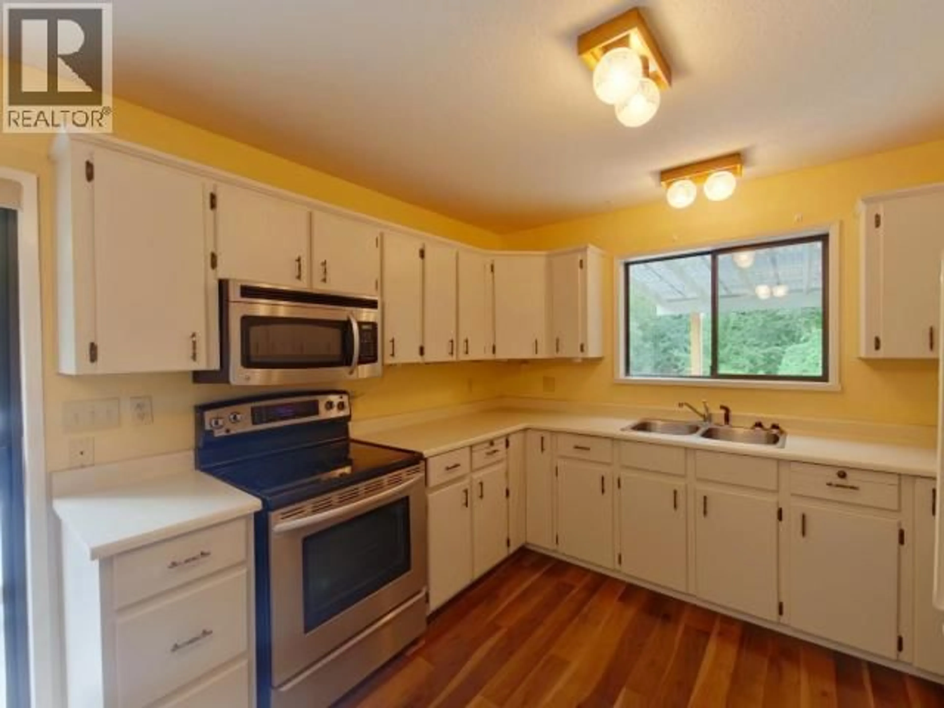 Standard kitchen, wood/laminate floor for 4849 TOMKINSON ROAD, Powell River British Columbia V8A0C5