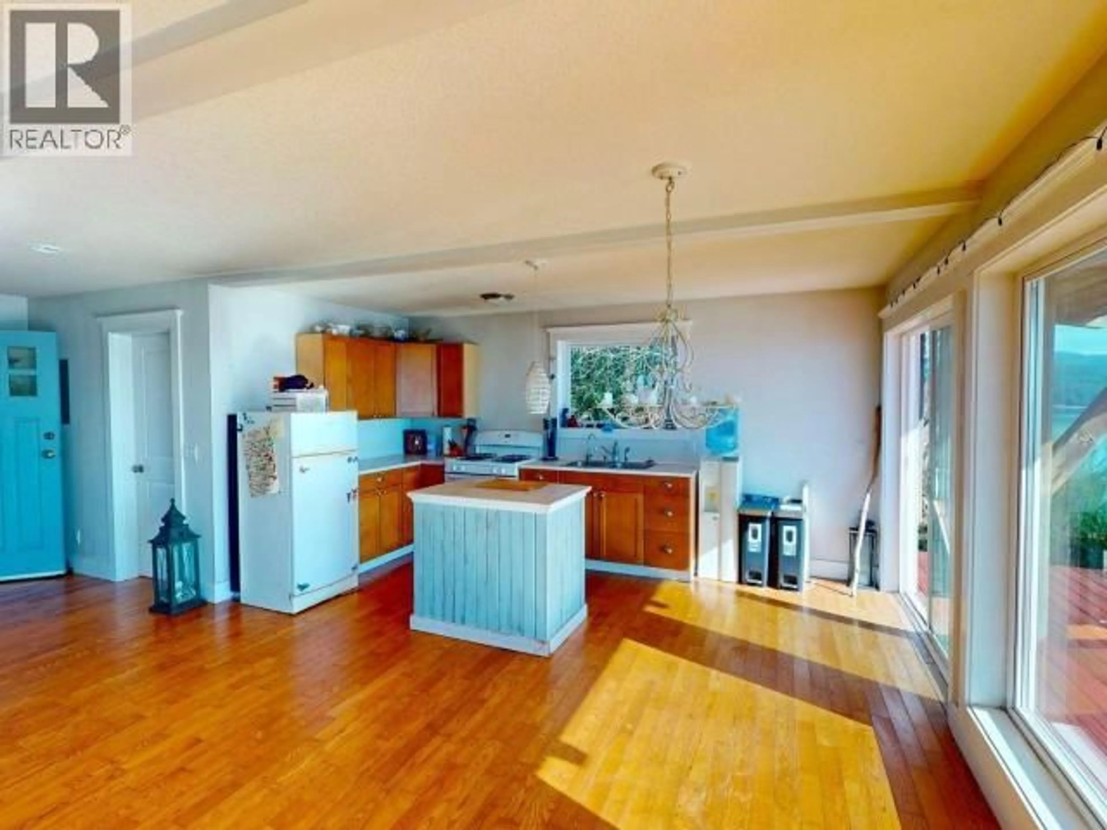 Open concept kitchen, wood/laminate floor for 3176 OCEANVIEW LANE, Savary Island British Columbia