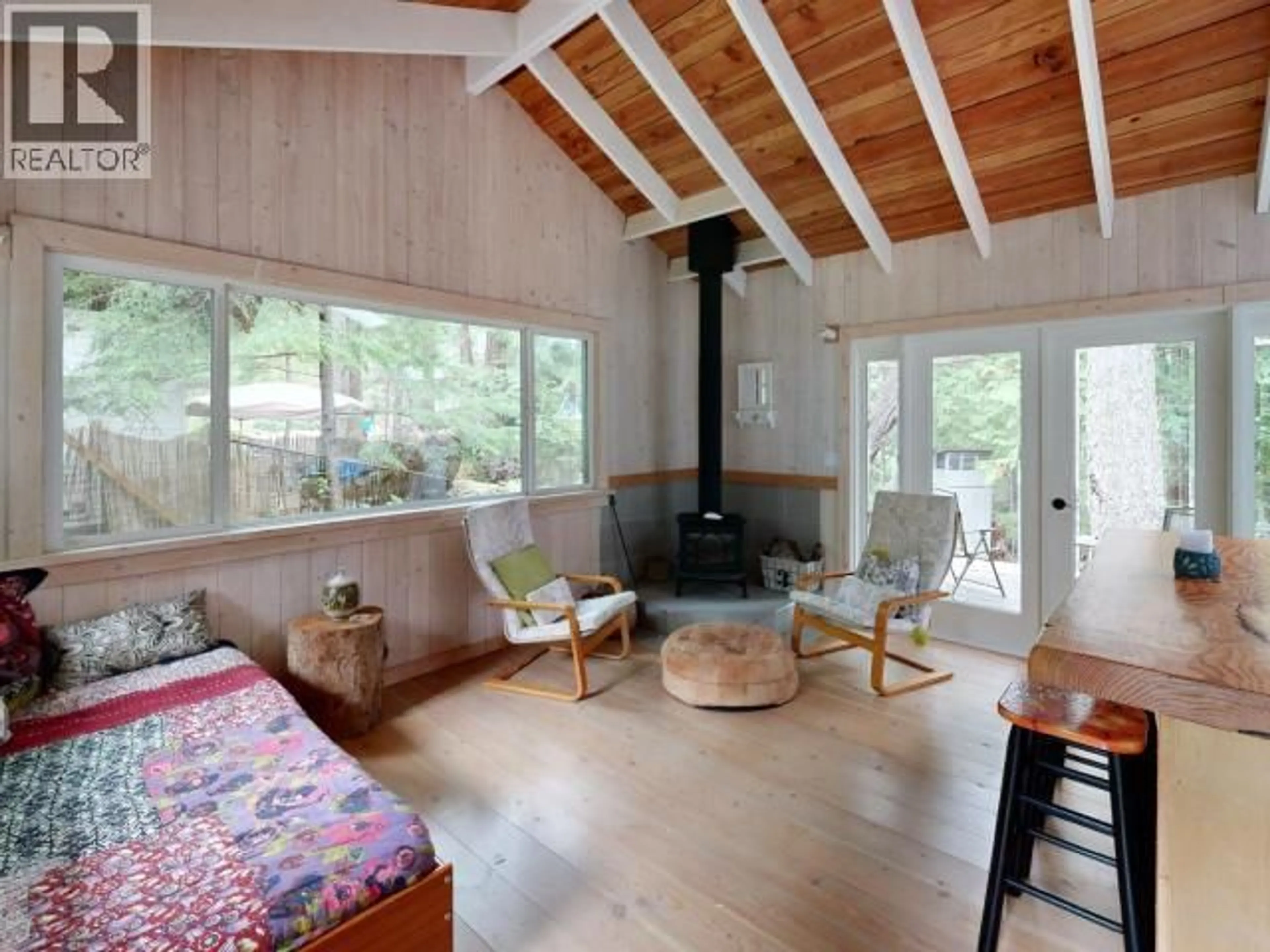 Living room with furniture, wood/laminate floor for 1847 VANCOUVER BLVD, Savary Island British Columbia V0N2G0