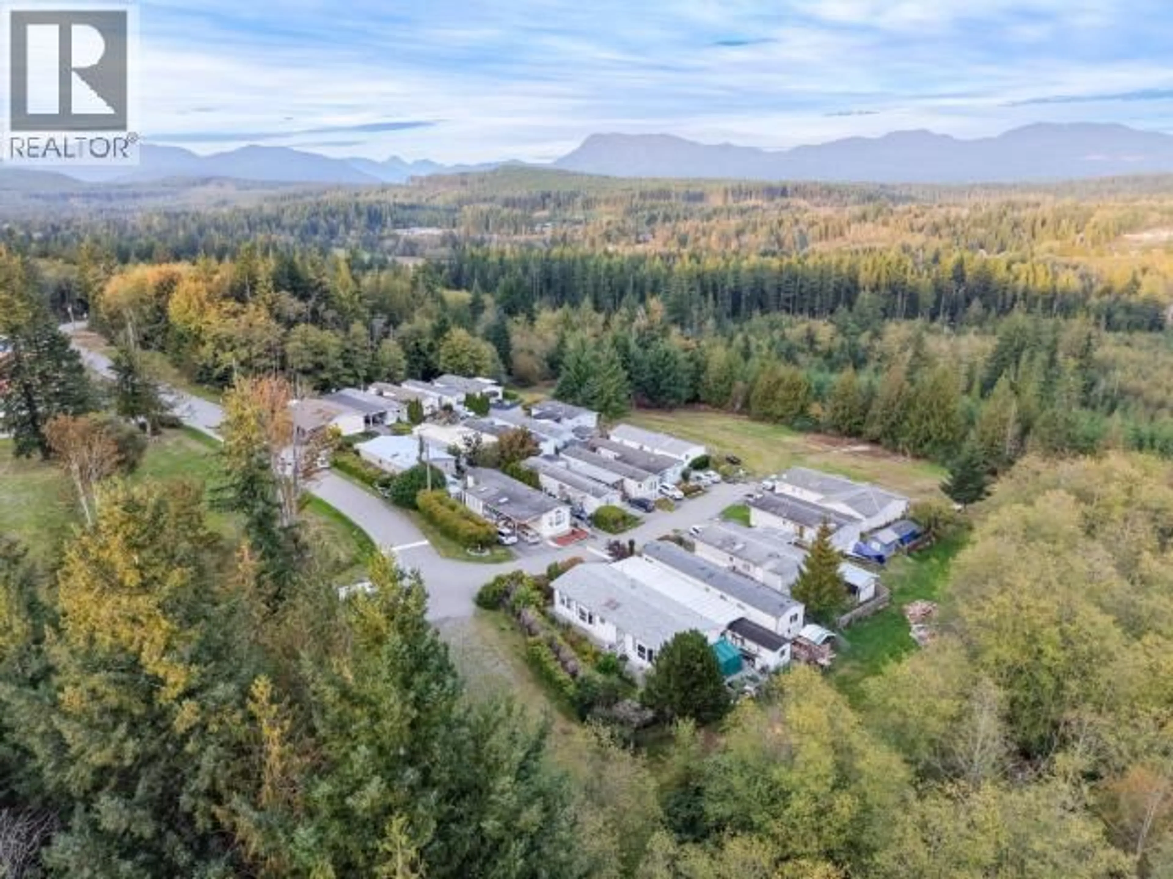 A pic from outside/outdoor area/front of a property/back of a property/a pic from drone, mountain view for 2 - 7520 NOOTKA STREET, Powell River British Columbia V8A5S2