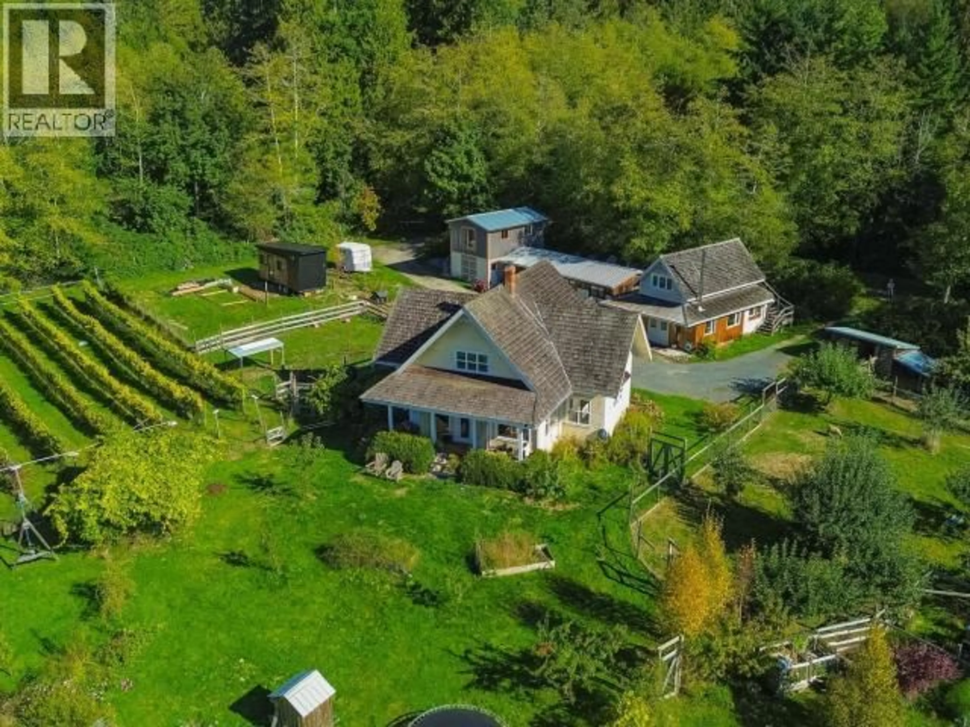 A pic from outside/outdoor area/front of a property/back of a property/a pic from drone, mountain view for 6701 MCMAHON AVENUE, Powell River British Columbia V8A4W2