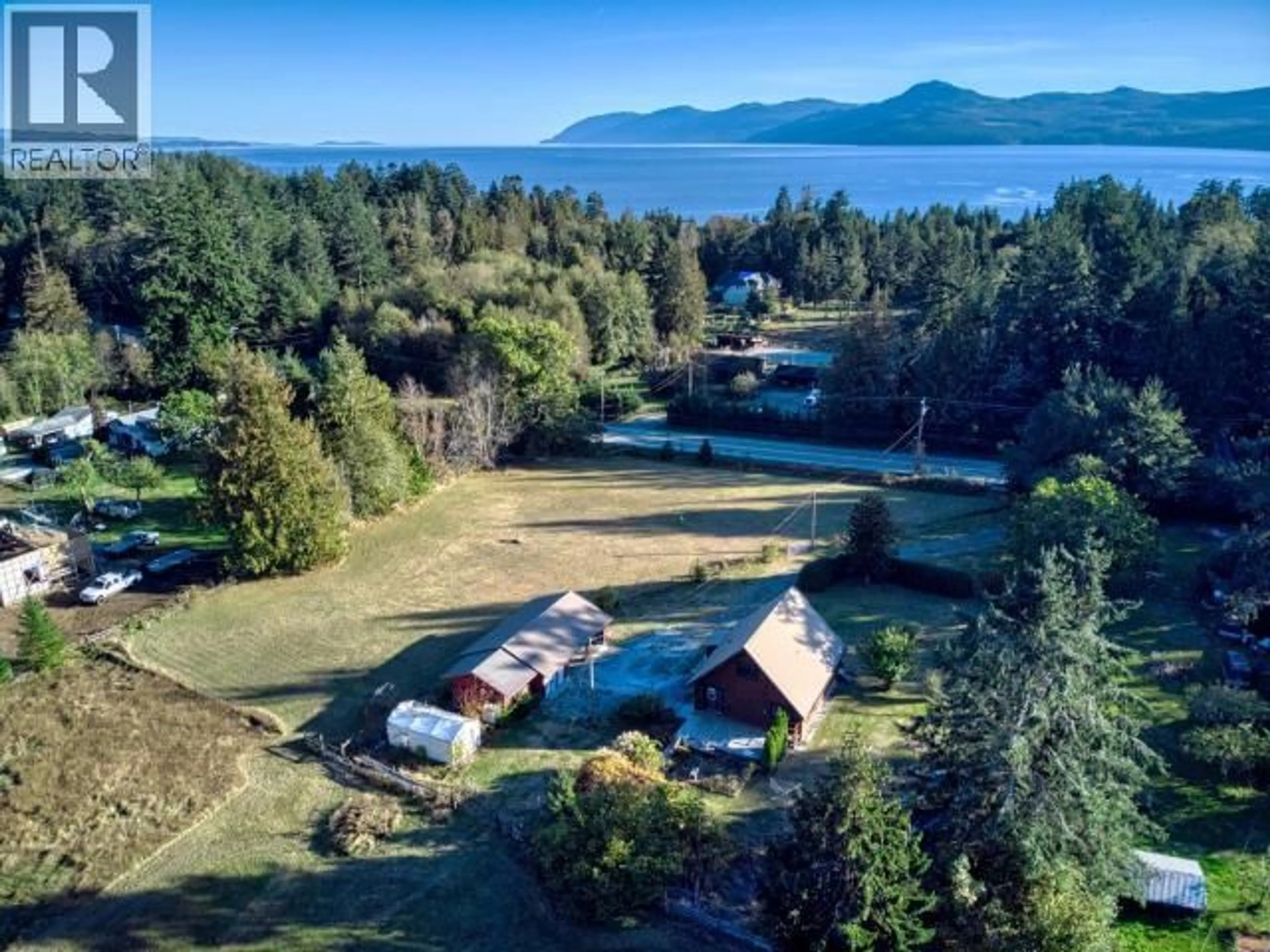 A pic from outside/outdoor area/front of a property/back of a property/a pic from drone, water/lake/river/ocean view for 10198 HIGHWAY 101, Powell River British Columbia