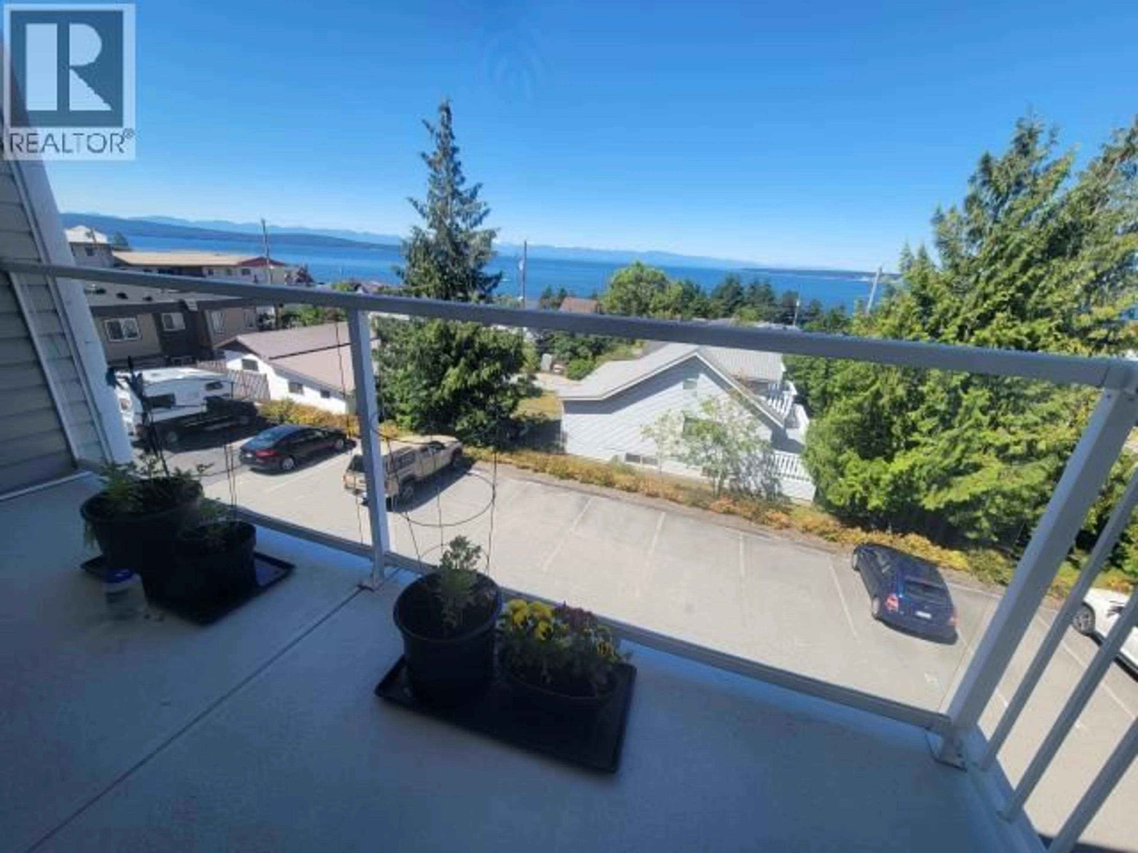 A pic from outside/outdoor area/front of a property/back of a property/a pic from drone, water/lake/river/ocean view for 302 - 6900 BURNABY STREET, Powell River British Columbia V8A1Y9