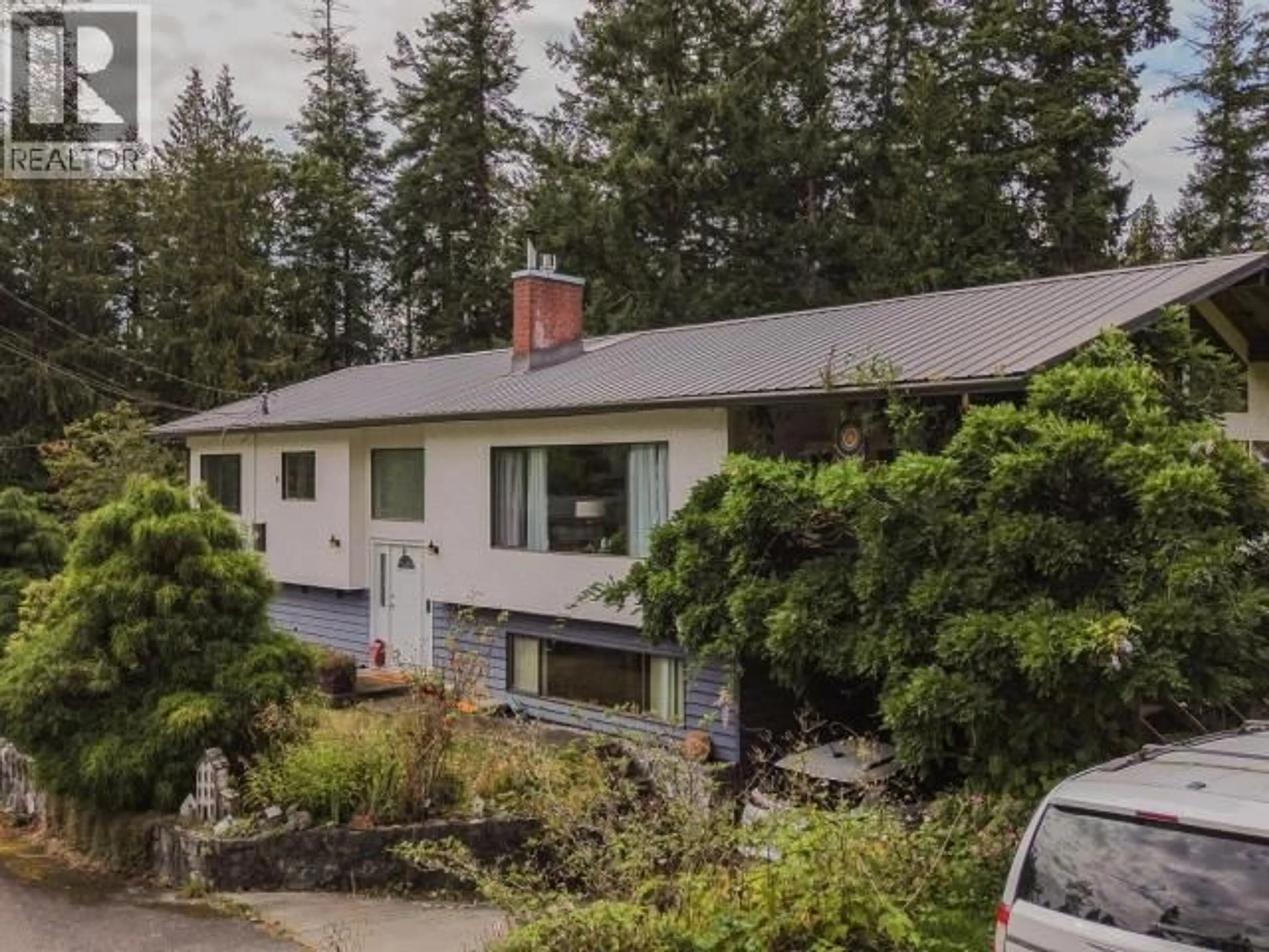 A pic from outside/outdoor area/front of a property/back of a property/a pic from drone, mountain view for 7889 HIGHWAY 101, Powell River British Columbia V8A0R7