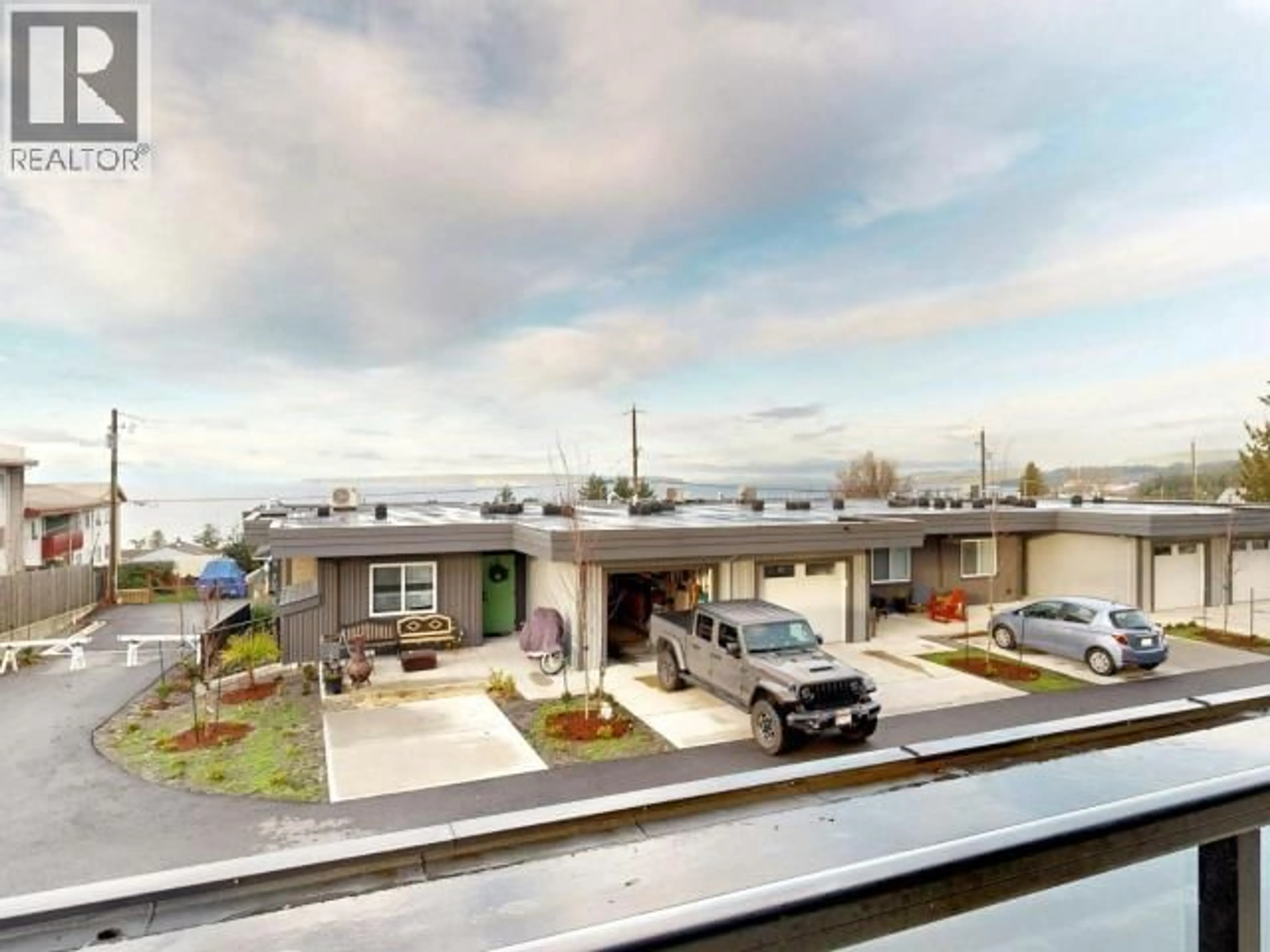 A pic from outside/outdoor area/front of a property/back of a property/a pic from drone, street for C104 - 6900 BURNABY STREET, Powell River British Columbia