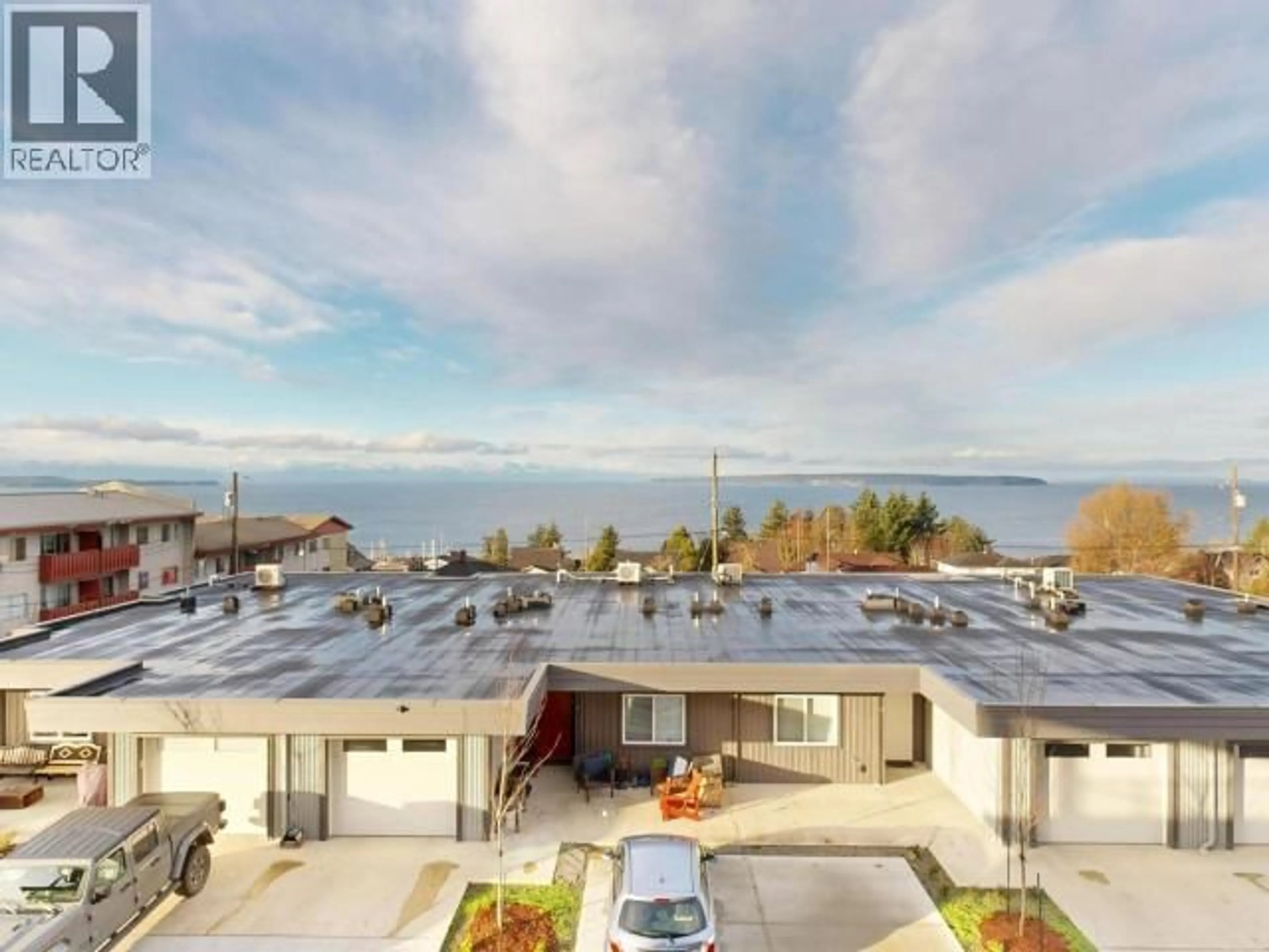 A pic from outside/outdoor area/front of a property/back of a property/a pic from drone, water/lake/river/ocean view for C203 - 6900 BURNABY STREET, Powell River British Columbia