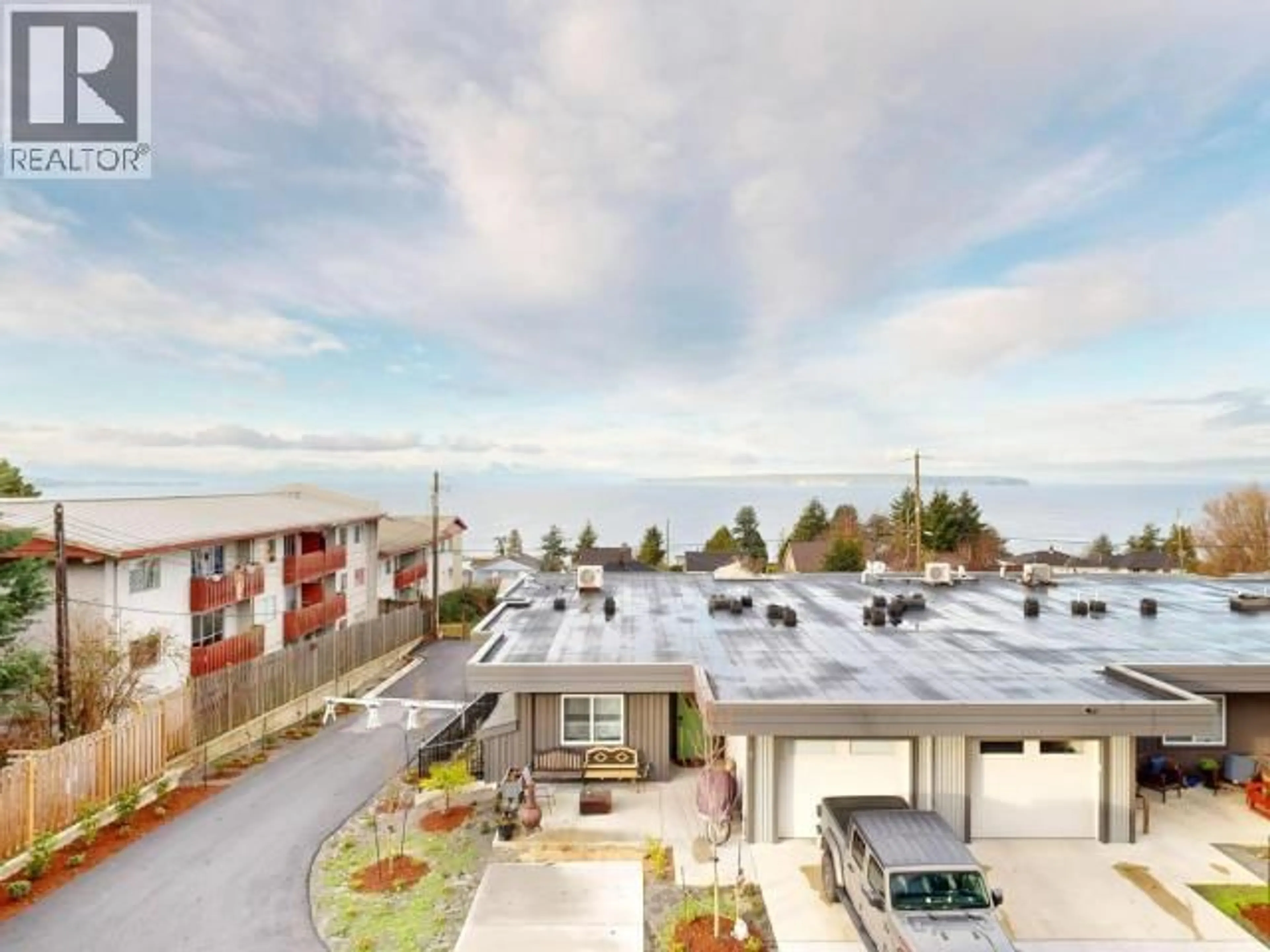 A pic from outside/outdoor area/front of a property/back of a property/a pic from drone, mountain view for C204 - 6900 BURNABY STREET, Powell River British Columbia