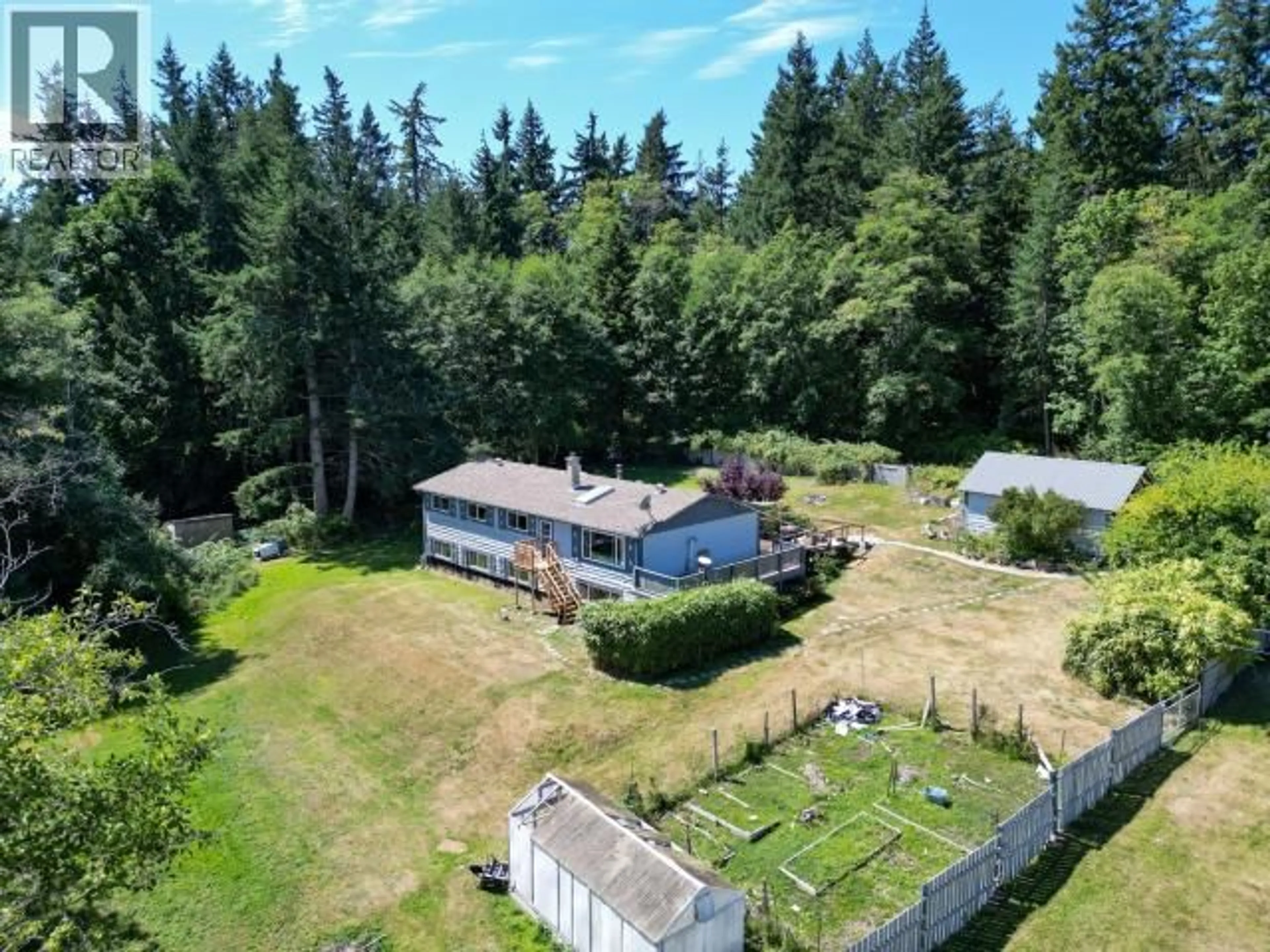 A pic from outside/outdoor area/front of a property/back of a property/a pic from drone, forest/trees view for 3008 ASH STREET, Texada Island British Columbia V0N1W0