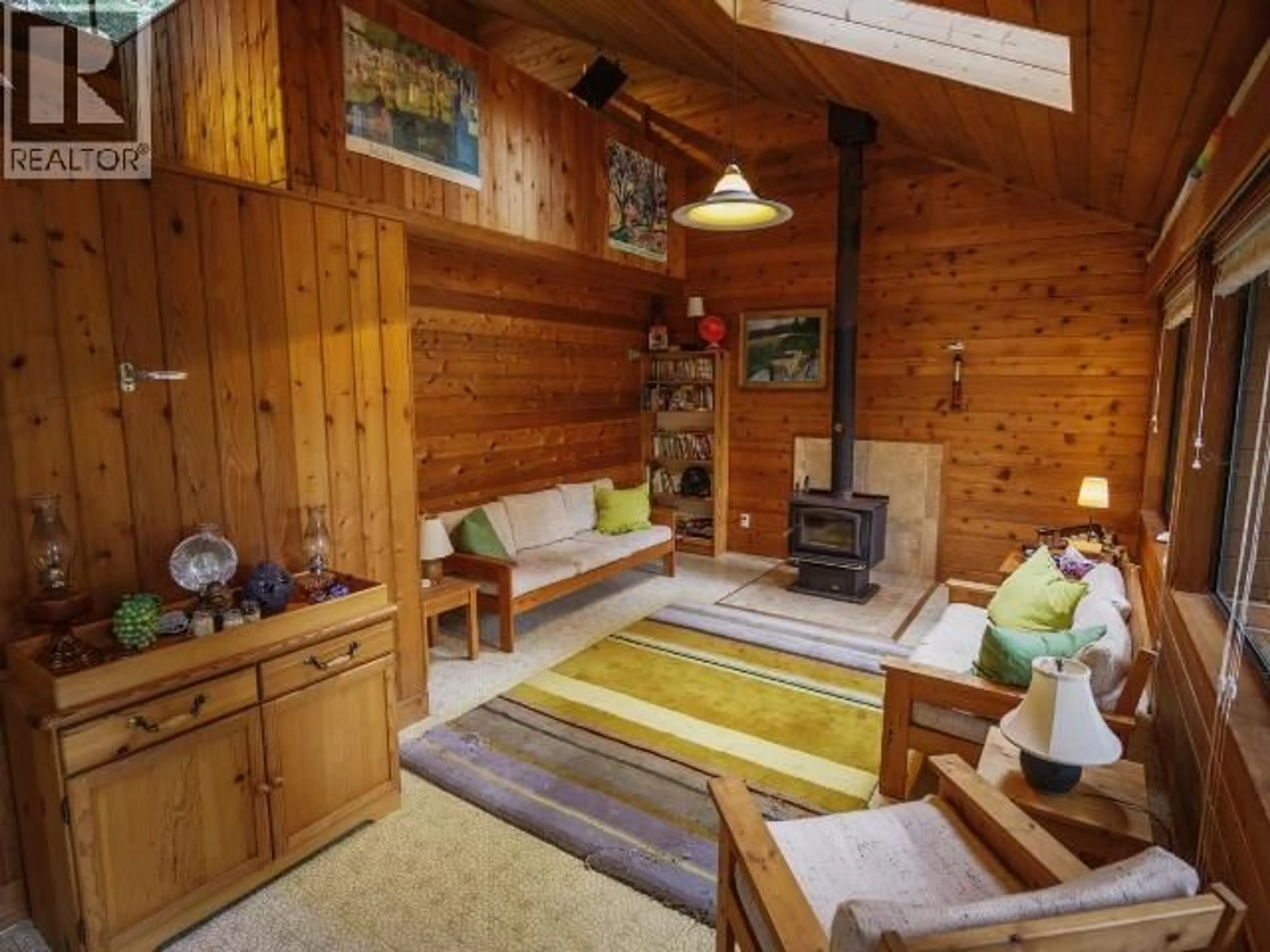 Living room with furniture, wood/laminate floor for 963 SPILSBURY DRIVE, Savary Island British Columbia V0N2G0