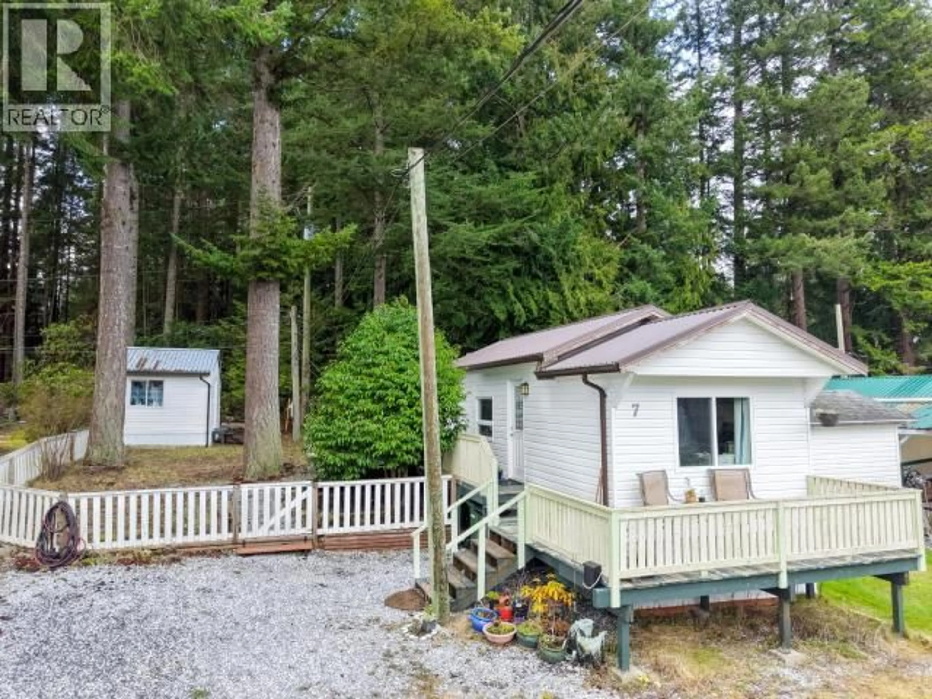 A pic from outside/outdoor area/front of a property/back of a property/a pic from drone, forest/trees view for 7 - 5455 BORDEN PLACE, Powell River British Columbia V8A3W1
