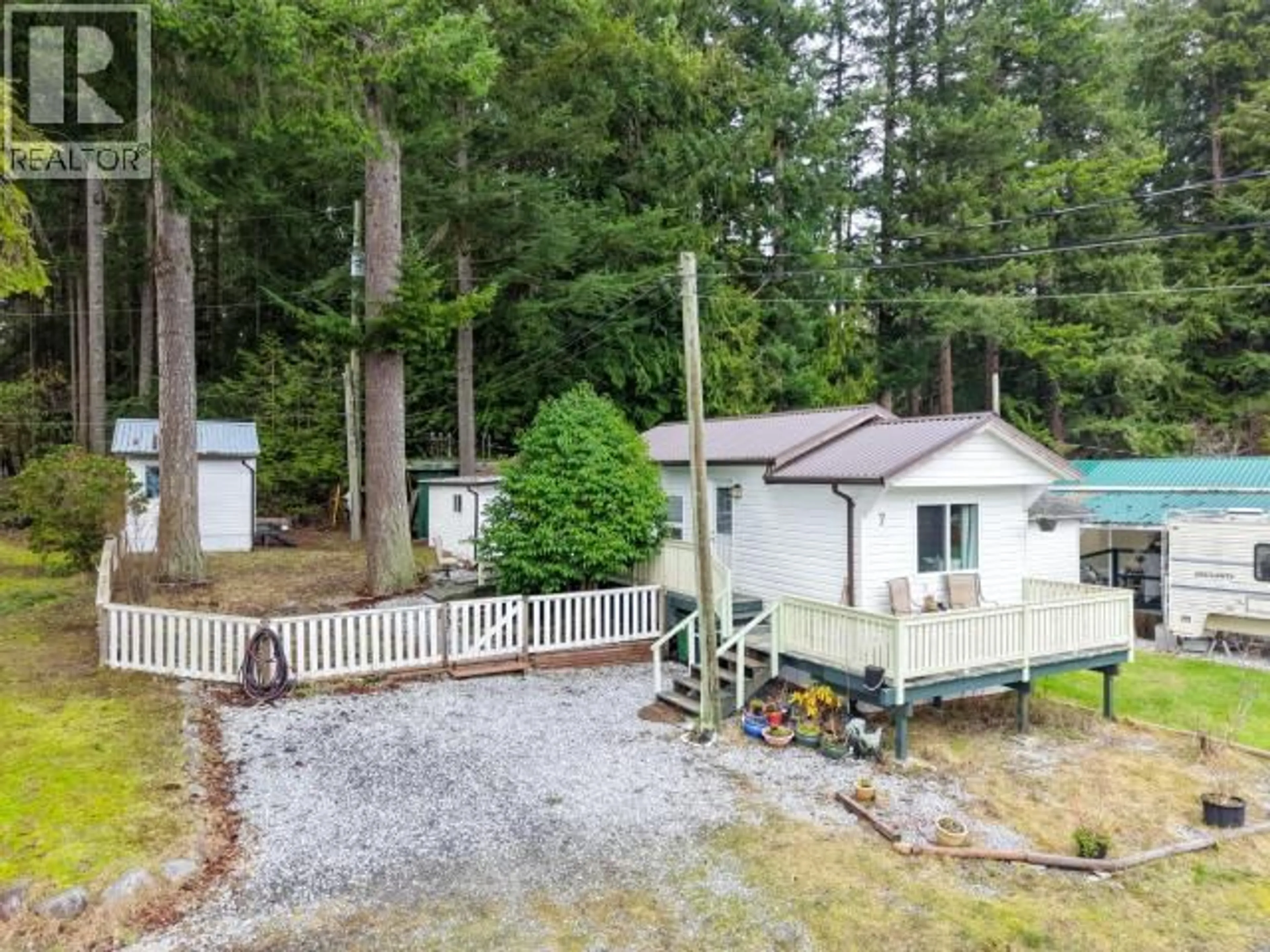 A pic from outside/outdoor area/front of a property/back of a property/a pic from drone, forest/trees view for 7 - 5455 BORDEN PLACE, Powell River British Columbia V8A3W1