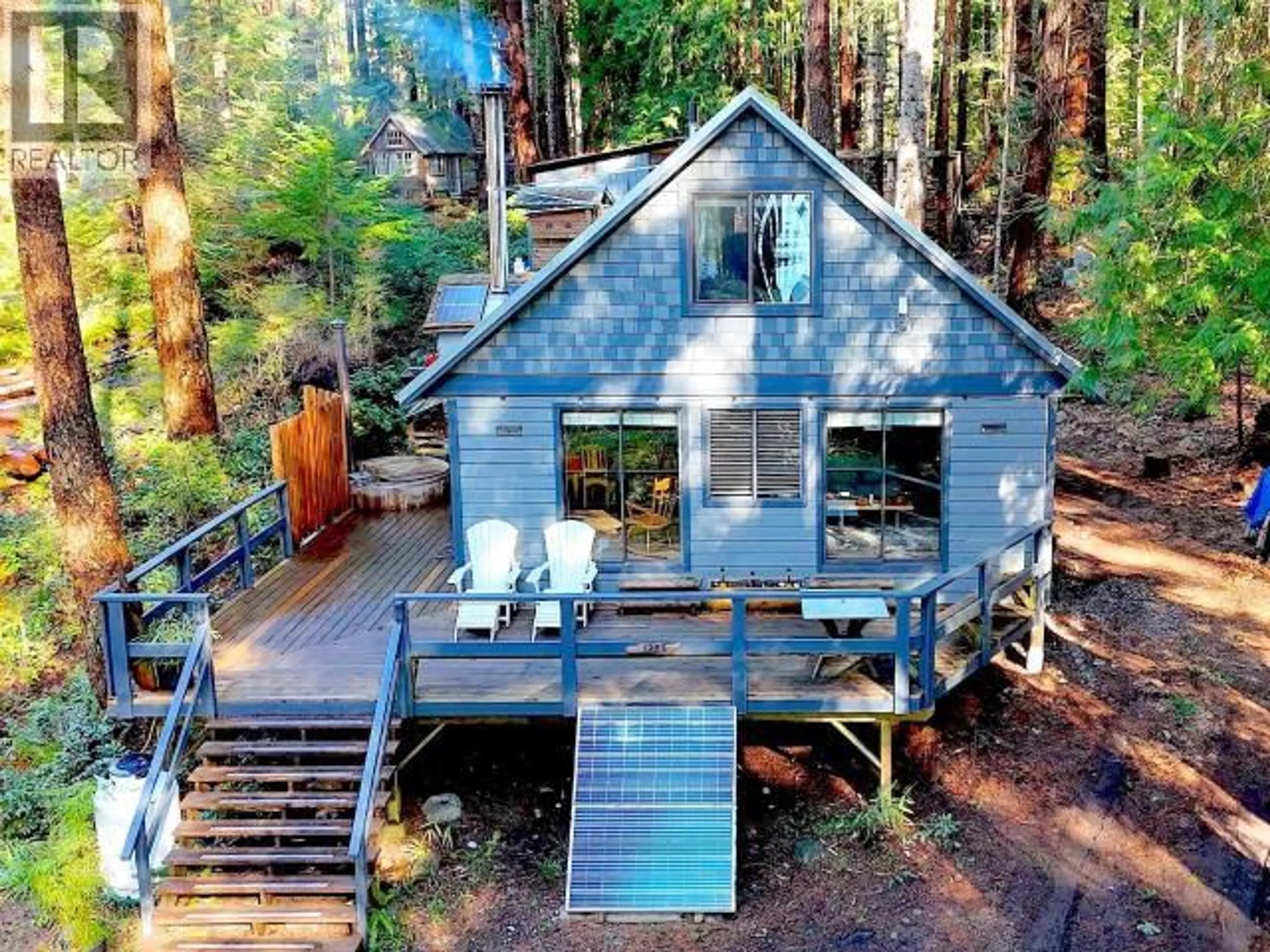 A pic from outside/outdoor area/front of a property/back of a property/a pic from drone, forest/trees view for 1283 TENNYSON RD, Savary Island British Columbia