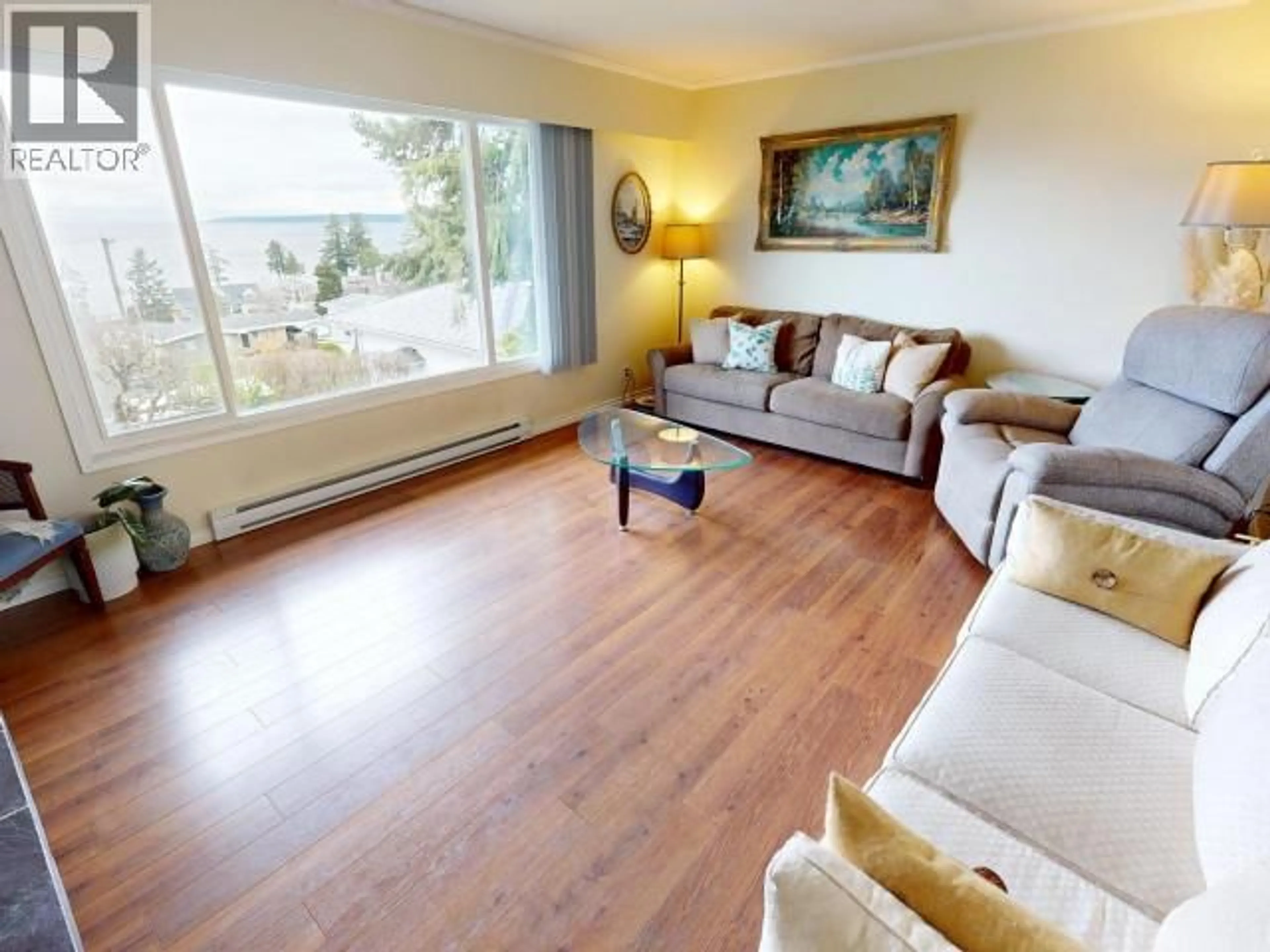 Living room with furniture, wood/laminate floor for 6955 TERRACE STREET, Powell River British Columbia V8A1H3