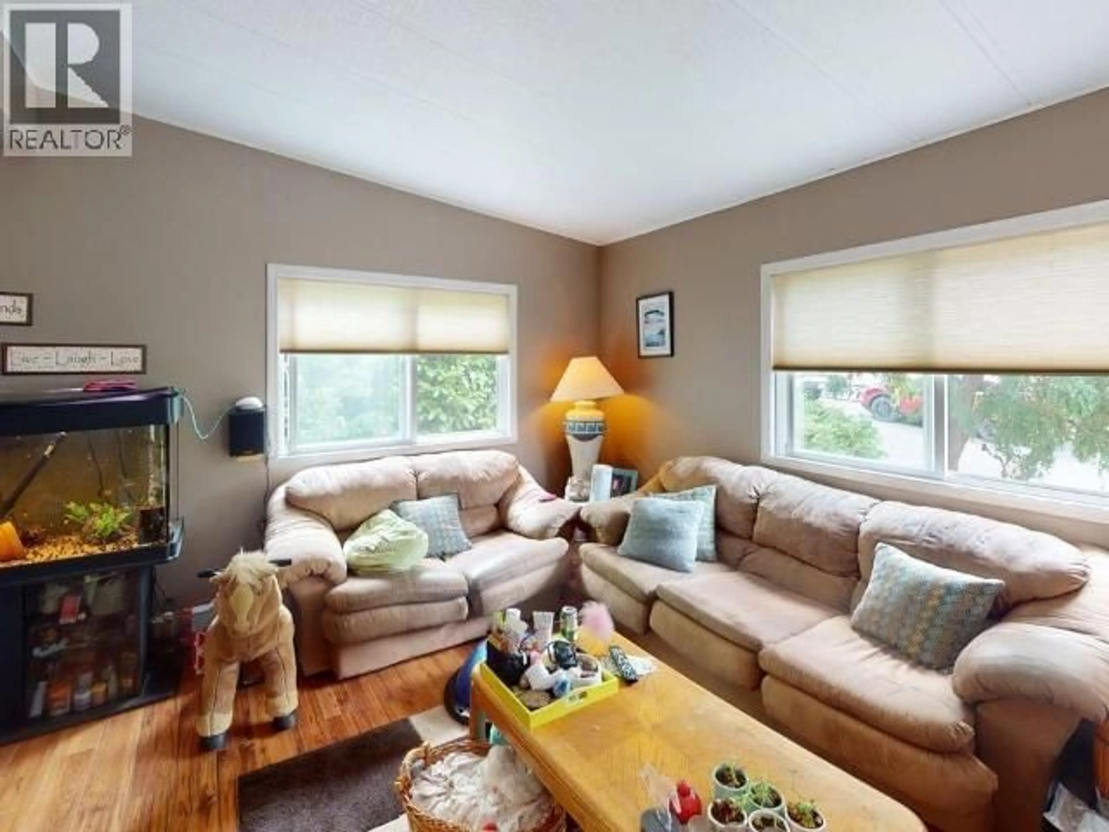 Living room with furniture, wood/laminate floor for 26-6271 MCANDREW AVE, Powell River British Columbia V8A5G3