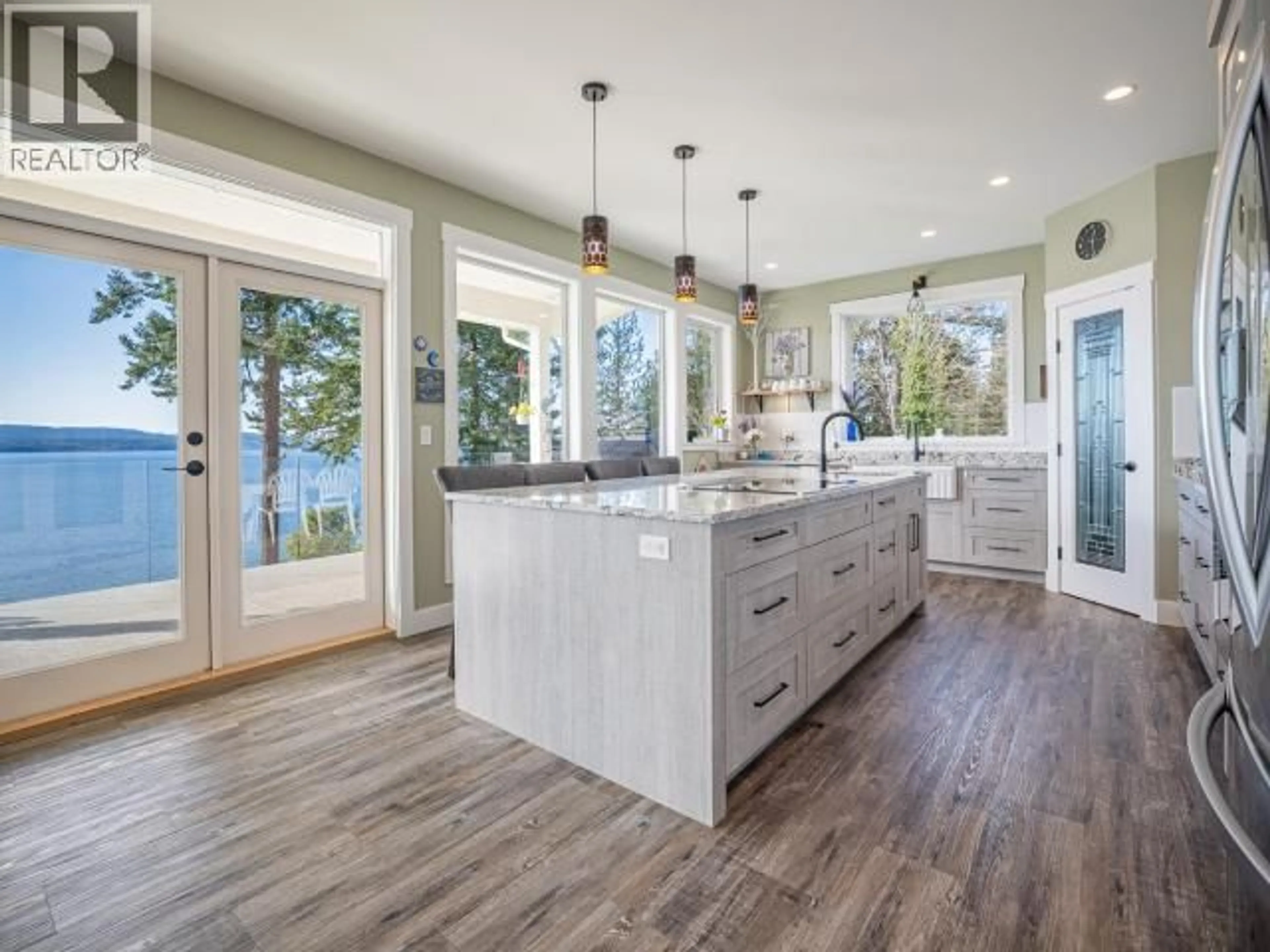 Open concept kitchen, wood/laminate floor for 8447 HIGHWAY 101, Powell River British Columbia V8A0G8