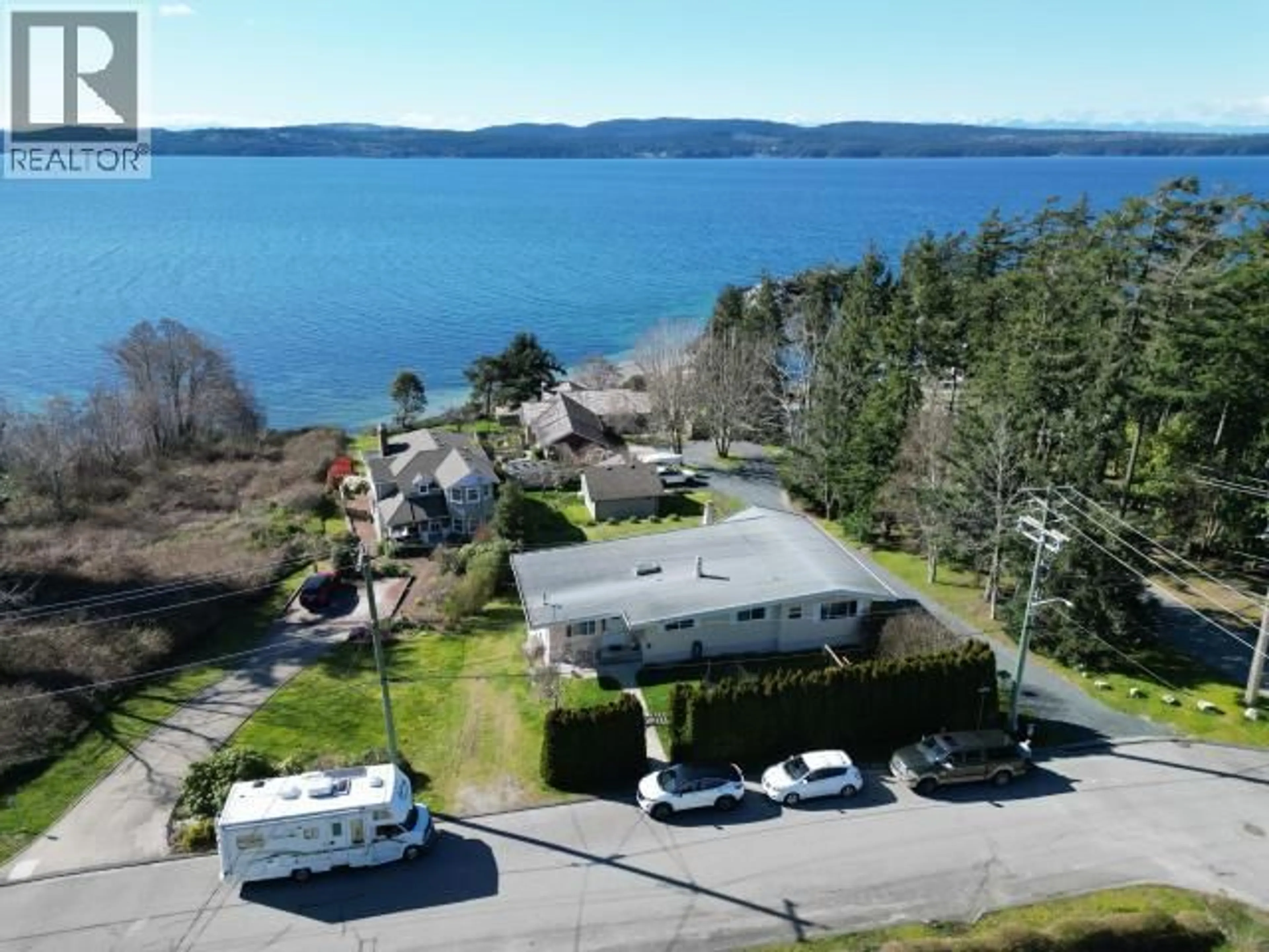 A pic from outside/outdoor area/front of a property/back of a property/a pic from drone, water/lake/river/ocean view for 7110 WESTMINSTER STREET, Powell River British Columbia V8A1C6