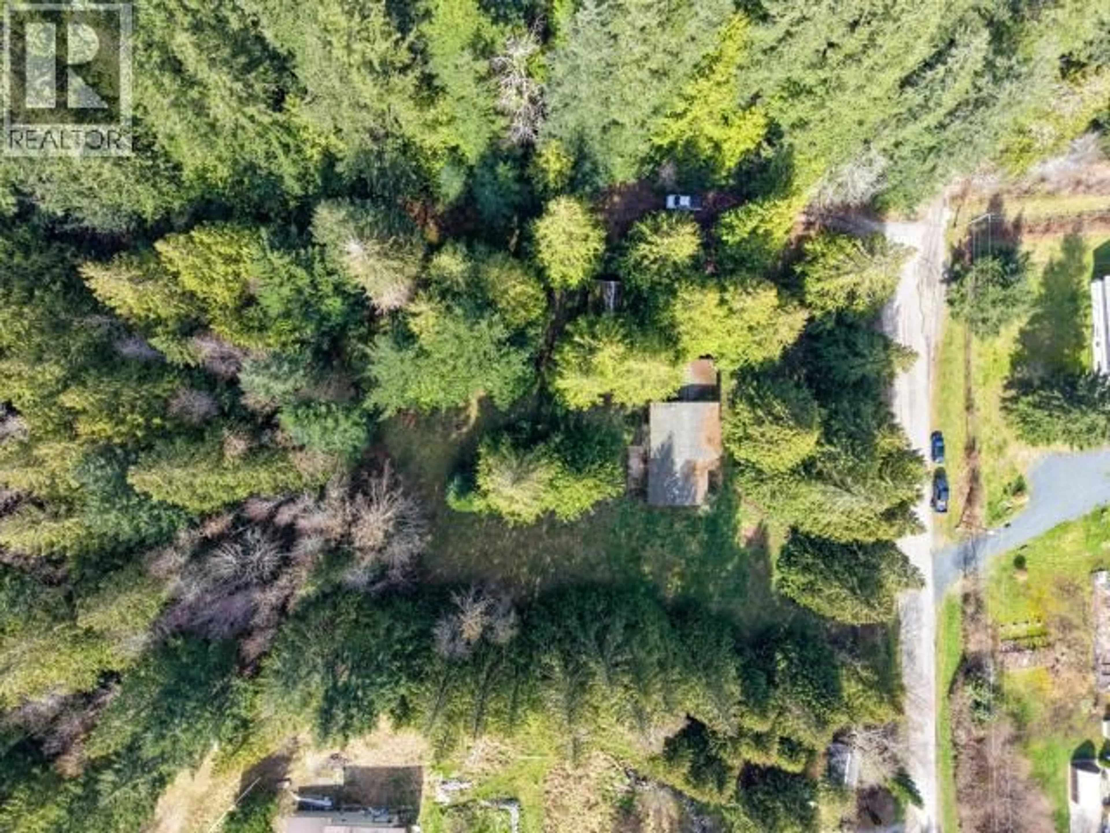 A pic from outside/outdoor area/front of a property/back of a property/a pic from drone, forest/trees view for 2217 BLACK POINT ROAD, Powell River British Columbia