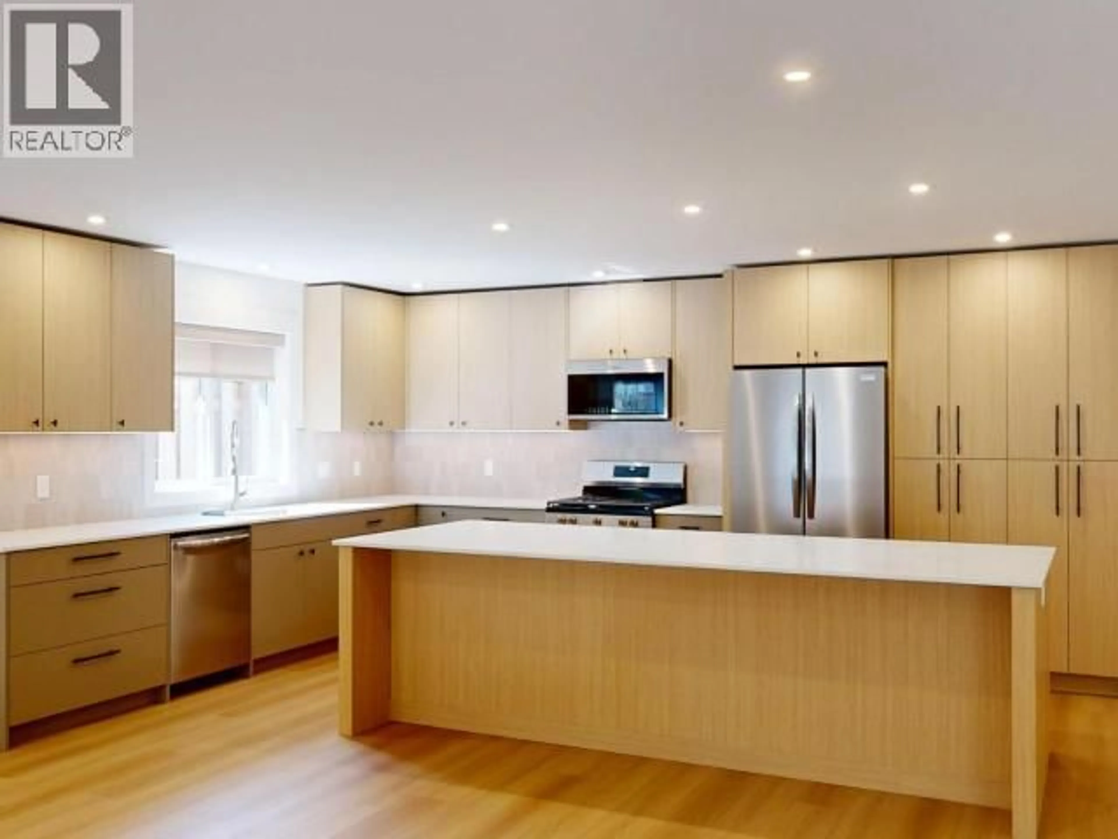 Open concept kitchen, wood/laminate floor for 4114 BEAUSEJOUR AVENUE, Powell River British Columbia V8A0A8