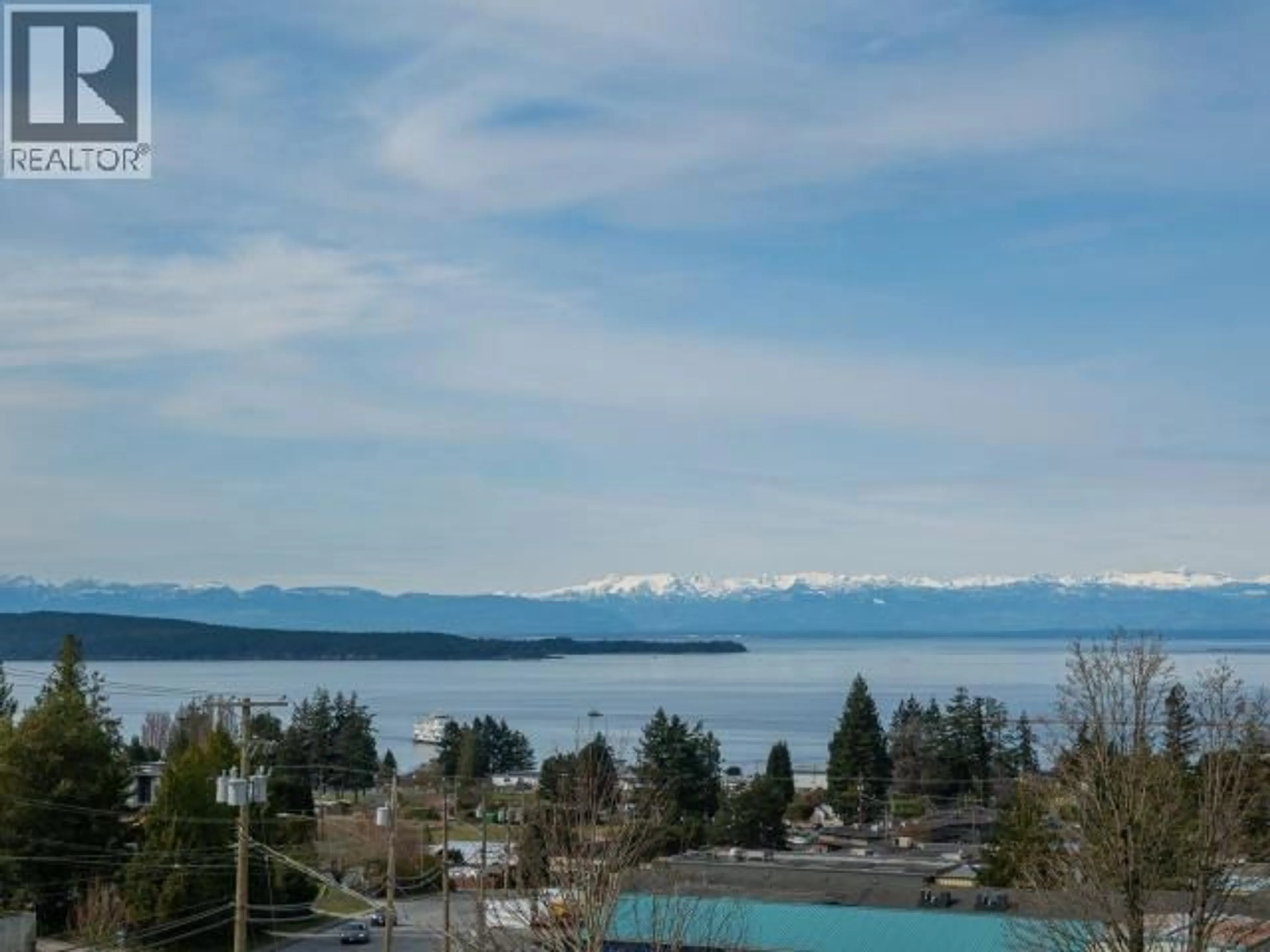 A pic from outside/outdoor area/front of a property/back of a property/a pic from drone, water/lake/river/ocean view for 403 - 7175 DUNCAN STREET, Powell River British Columbia V8A1W3