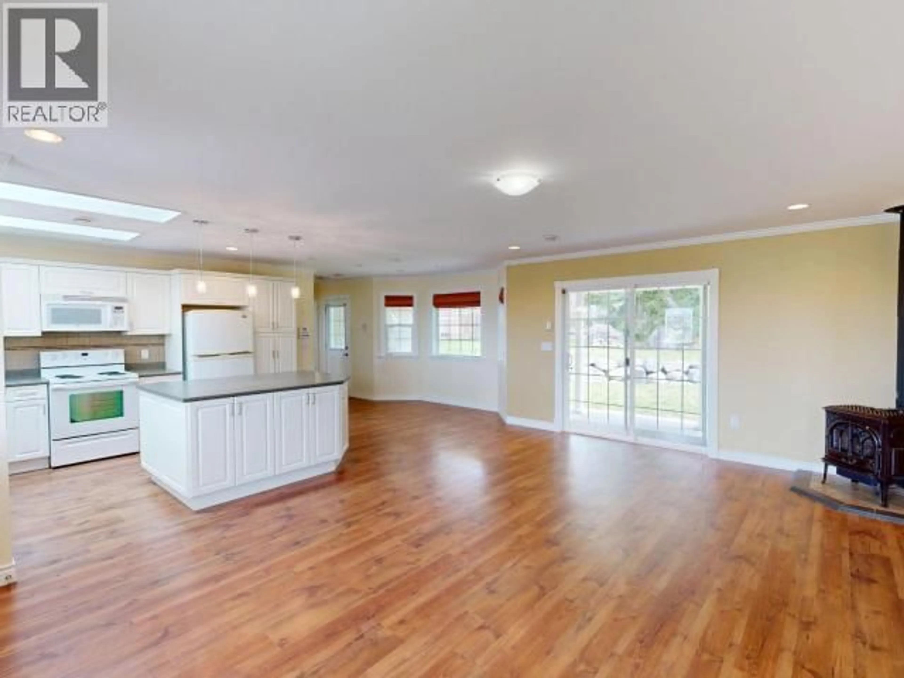 Open concept kitchen, wood/laminate floor for 5640 GAUDET AVE, Powell River British Columbia V8A4B6